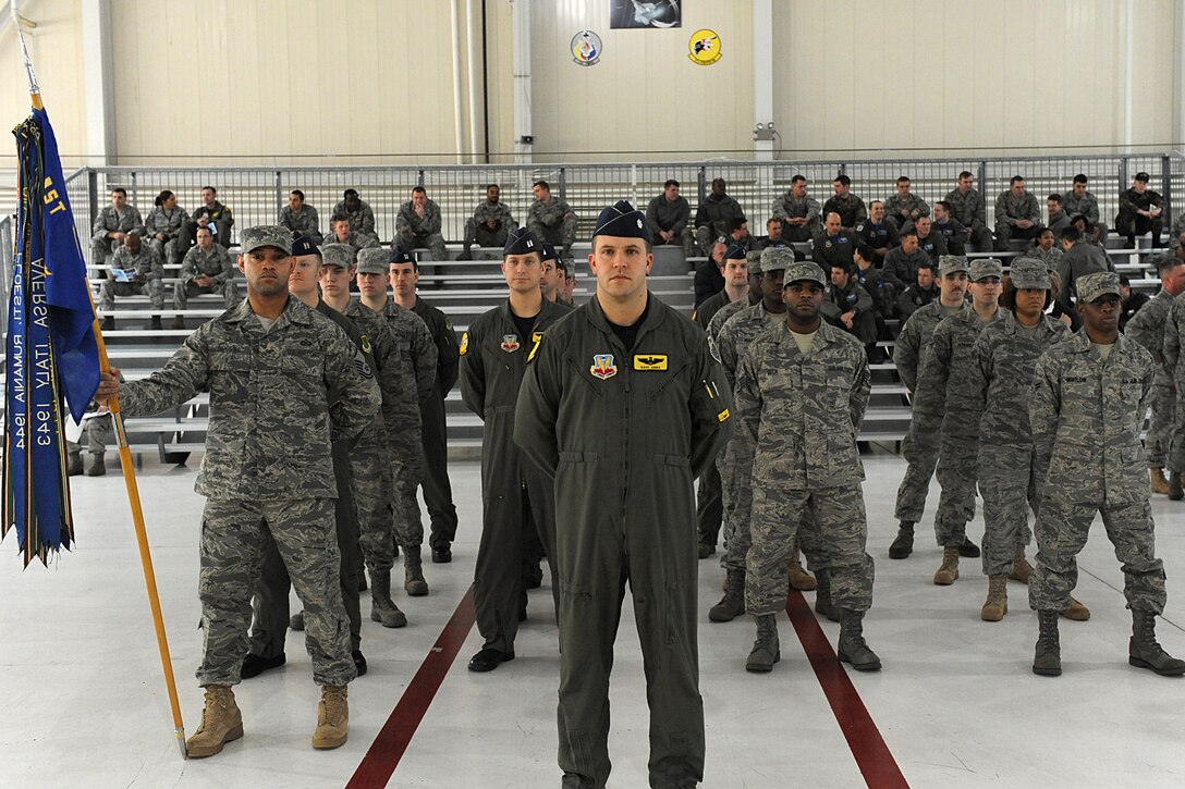 LANGLEY AIR FORCE BASE, Va. -- Members of the 27th Fighter Squadron stand at parade rest prior to the entrance of the official party March 5 for the 27 FS change-of-command ceremony.   Lt. Col. Lansing Pilch  relinquished command to Lt. Col. Pete Fesler after serving nearly two years as commander.  (U.S. Air Force photo/Senior Airman Zachary Wolf)