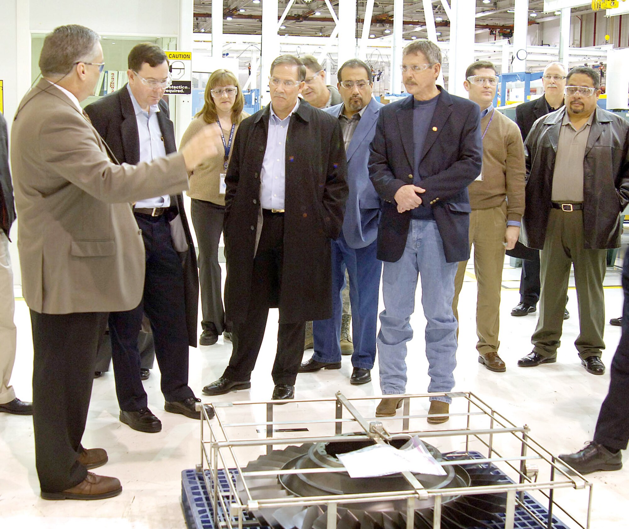 Jimmie Green of Tinker's 544th Propulsion Maintenance Squadron (left) takes leaders from Air Force Materiel Command's unions and civil service through a work area Feb. 22 through 24 at Tinker AFB, Okla. The group converged for an American Federation of Government Employees Partnership Council meeting and updates on Tinker's production work. (U.S. Air Force photo/Margo Wright)