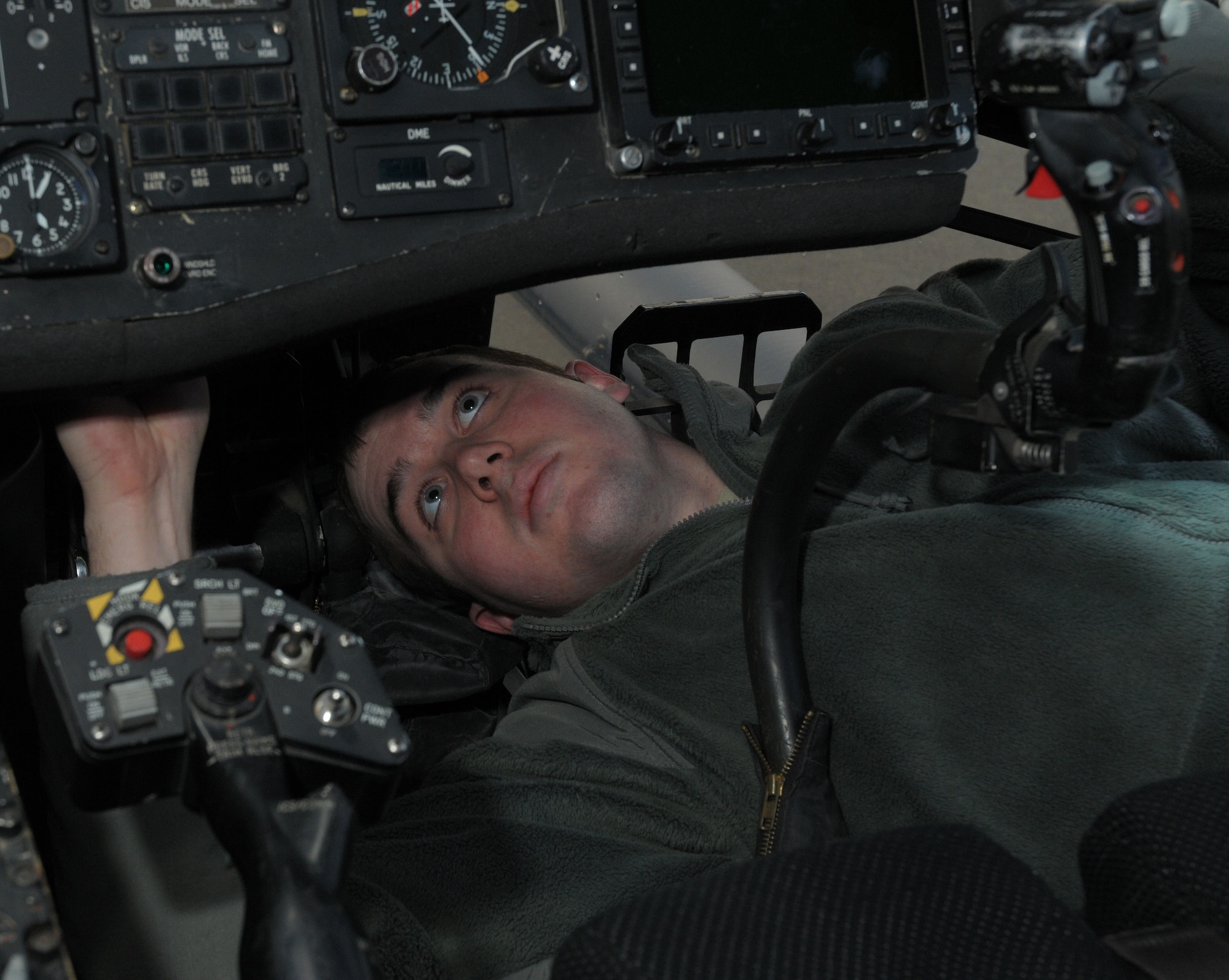 Airman 1st Class Thomas Johns, 748th Aircraft Maintenance Squadron, 56th Helicopter Maintenance Unit Instruments and Flight Controls Avionics journeyman, troubleshoots an engine indicating system on a HH-60G Pave Hawk helicopter at RAF Lakenheath, England, Mar. 1, 2010.  The engine indicating system controls the readings of different engine pressures such as torque, fuel and temperature.  (U.S. Air Force photo/Staff Sgt. Connor Estes)