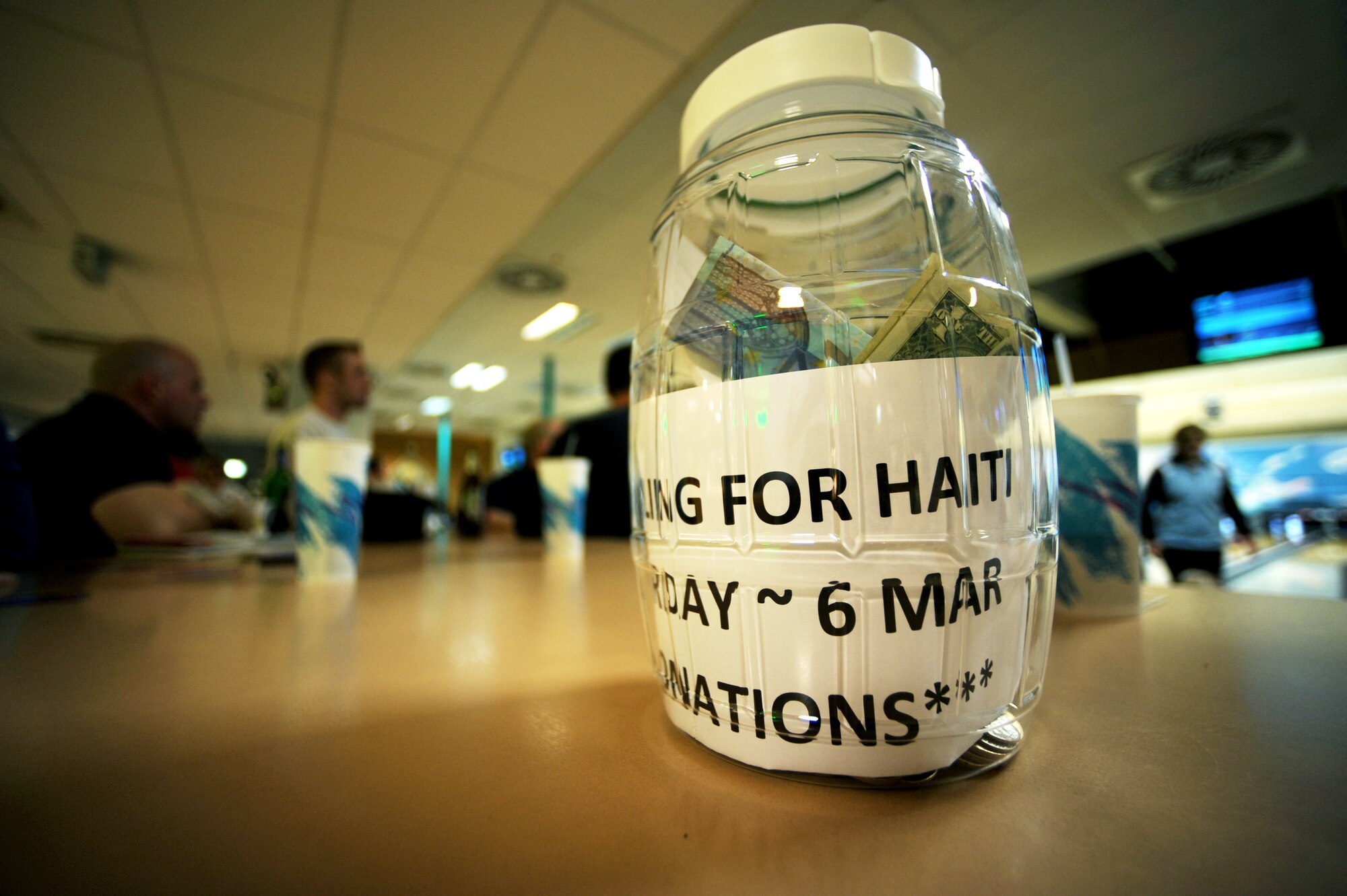 U.S. military members along with friends and family participate with the Bowling for Haiti fundraiser at the bowling center, Ramstein Air Base, Germany, March 6, 2010. The event collected over two thousand dollars that will be given to The American Red Cross Haiti Relief and Development Fund. (U.S. Air Force photo by Tech. Sgt. Sarayuth Pinthong)
