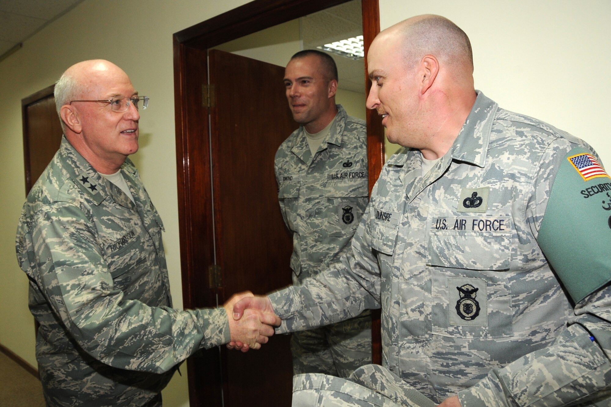 (Ch.) Maj. Gen. Cecil Richardson, Air Force Chief of Chaplains, visits 380th Expeditionary Security Forces Squadron members, during a recent visit to an undisclosed location in Southwest Asia on March 5, 2010. (Ch.) Maj. Gen. Richardson visited various units around the 380th Air Expeditionary Wing as well as speaking at the "Gospel Explosion" musical event. The 380th AEW supports Operations Iraqi Freedom and Enduring Freedom and the Combined Joint Task Force-Horn of Africa. The 380th AEW is comprised of four groups and 12 squadrons and the wing's deployed mission includes air refueling, surveillance and reconnaissance in support of overseas contingency operations in Southwest Asia. (U.S. Air Force photo/Senior Airman Jenifer H. Calhoun/Released)



