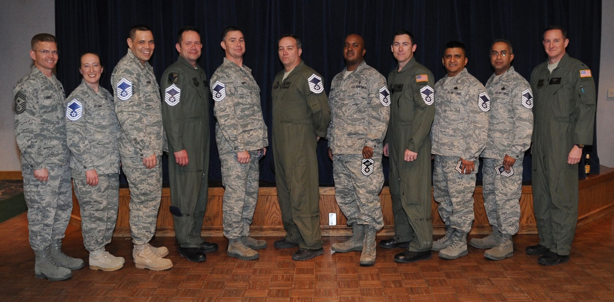 Chief Master Sgt. William Turner (left), 27th Special Operations Wing command chief and (right) Col. Stephen Clark, 27 SOW commander, flank Cannon Air Force Base, N.M., senior master sergeant selects Bobbi Jo Stumpf, Roddy Martin, Robert West, Charles Nimmo, Robert McDonald, Kelby Norton, William Seaman, Luis Acuria and Frankline Varghese. The Air Force officials  announced that 1,450 of 13,216 eligible master sergeants were selected for promotion to senior master sergeant March 4 for a selection rate of 10.97 percent.  (U.S. Air Force photo by Airman 1st Class Maynelinne De La Cruz)