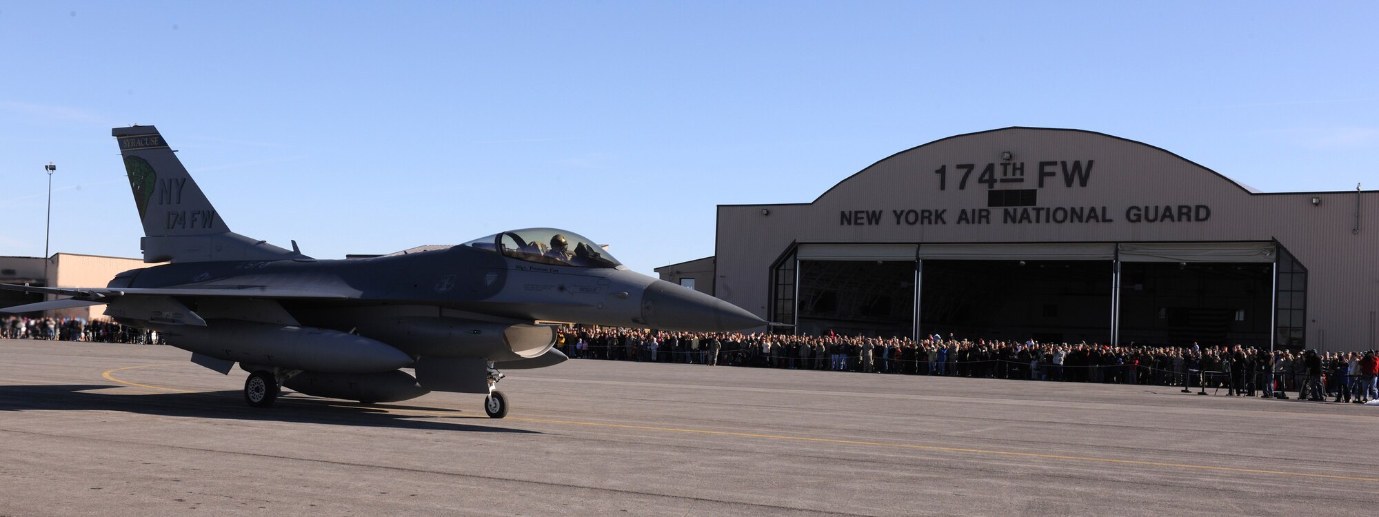 174th Fighter Wing Commander Colonel Kevin W. Bradley taxis past assembled  family, friends and distinguished visitors for the last time with the F-16 at Hancock Field Air National Guard Base. The 174th Fighter Wing has converted to the MQ-9 Reaper and began flying 24/7 operations in support of Operation Enduring Freedom on 1 December 2009. (US Air Force photo by Staff Sgt James N. Faso II/Released) 