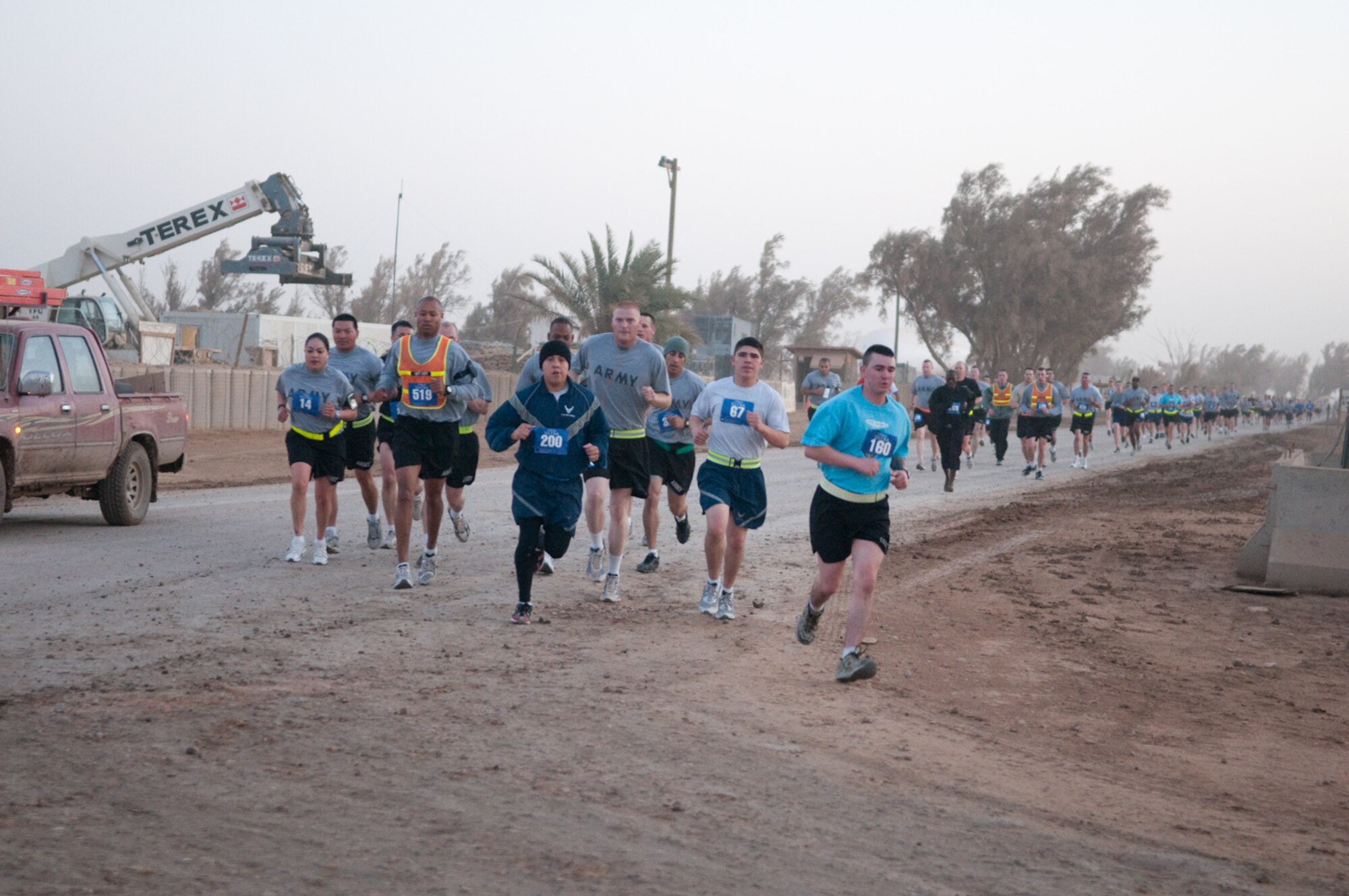 Over 450 Airmen, Soldiers, Sailors and civilians at Contingency Operating Base Adder, Iraq participated in the El Paso Half-Marathon to show solidarity with the City of El Paso, the sponsor, along with Fort Bliss, Texas,  Feb. 26, 2010.  Among the participants are Ugandan army soldier and an Iraqi army soldier along with numerous U.S. servicemembers. (U.S. Air Force photo by Senior Master Sgt. Elizabeth Gilbert/released.)