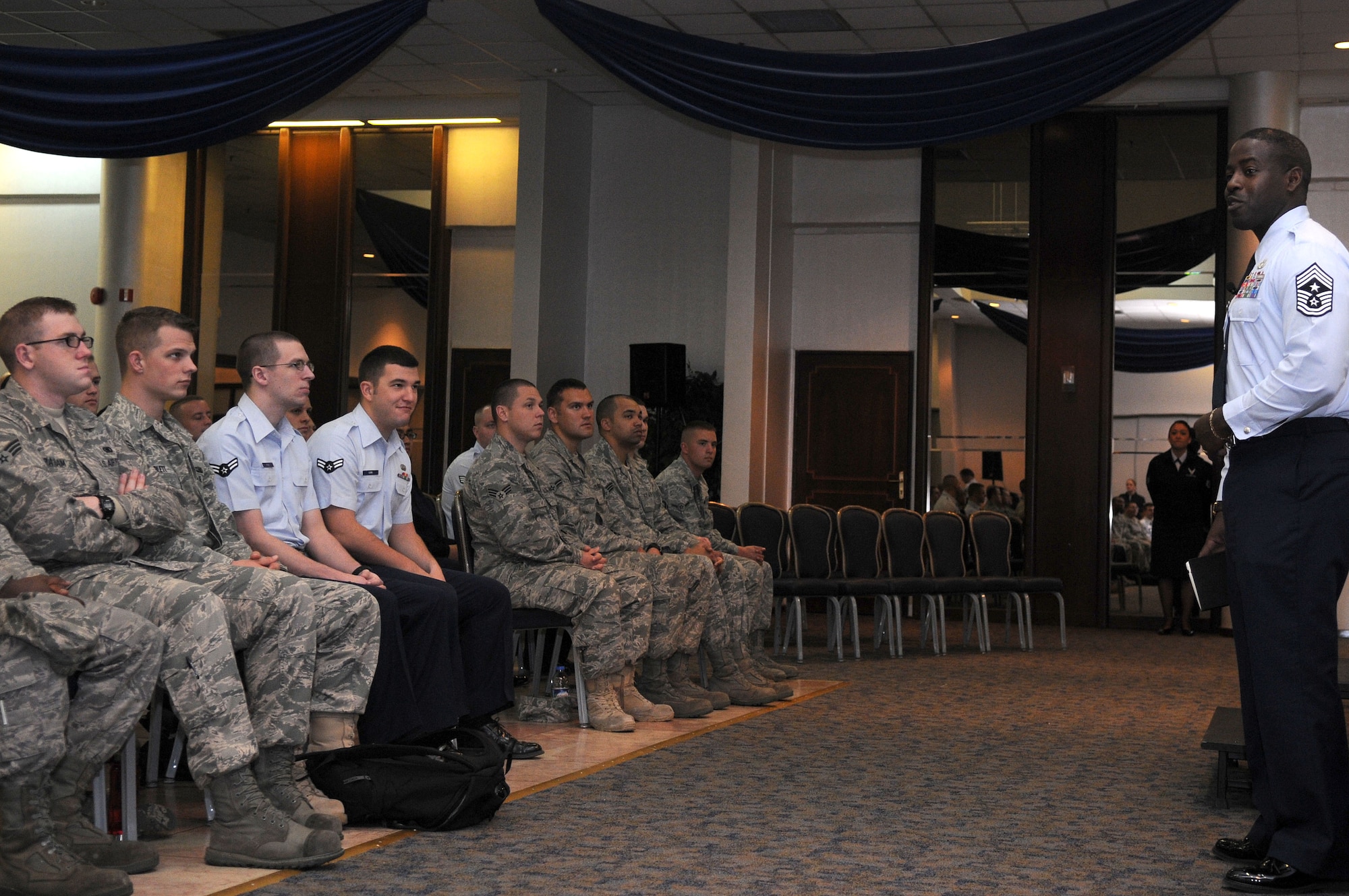 Chief Master Sgt. Marcus Snoddy, 39th Air Base Wing command chief, speaks to Airmen about his expectations during an Airman’s call, March 8, 2010 at Incirlik Air Base, Turkey.  Chief Snoddy also interacted with the Airmen to get their point of view on certain topics and shared some information about himself.  (U.S. Air Force photo/Senior Airman Ashley Wood)