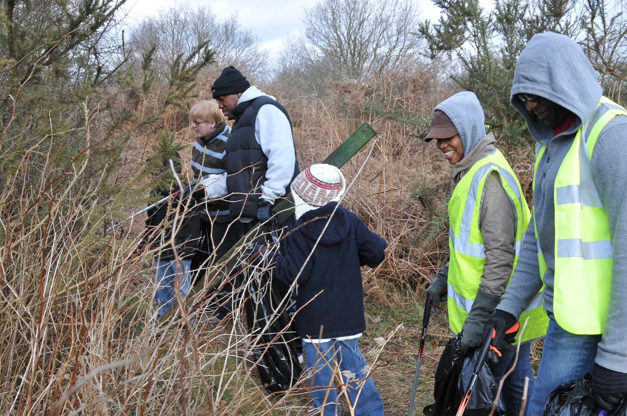 RAF MILDENHALL, England – Volunteers from RAF Mildenhall, local constables and Red Lodge villagers clean up an area in Red Lodge March 6. The effort was part of a wildlife cleanup effort sanctioned by the Forest Heath District Council and the Red Lodge Conservation Group. (U.S. Air Force photo/Tech. Sgt. Kevin Wallace)