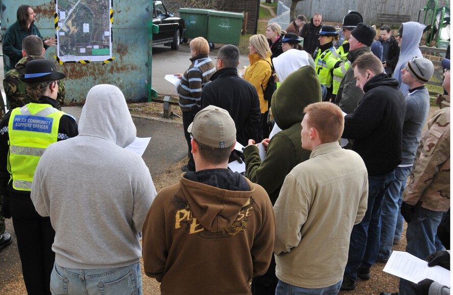 RAF MILDENHALL, England – Volunteers meet at the Millennium Centre in Red Lodge to receive a safety brief and be issued equipment prior to cleaning up a nearby heath March 6. In all, more than 30 Airmen from RAF Mildenhall, about 10 local constables and several Red Lodge villagers joined together for the effort.  (U.S. Air Force photo/Tech. Sgt. Kevin Wallace)