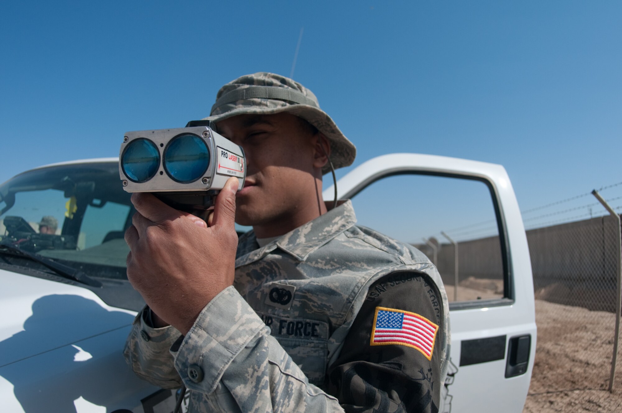 Airman 1st Class Erin Simmons, 732 ESFS, Det. 5, Provost Marshal’s Office, checks the speed of a passing vehicle using a radar ‘gun’ at Ali Base, Iraq, March 3, 2010.  The PMO is stepping up its enforcement of traffic regulations in a concerted effort to reduce the number of traffic mishaps.  (U.S. Air Force photo by Senior Master Sgt. Elizabeth Gilbert/released)