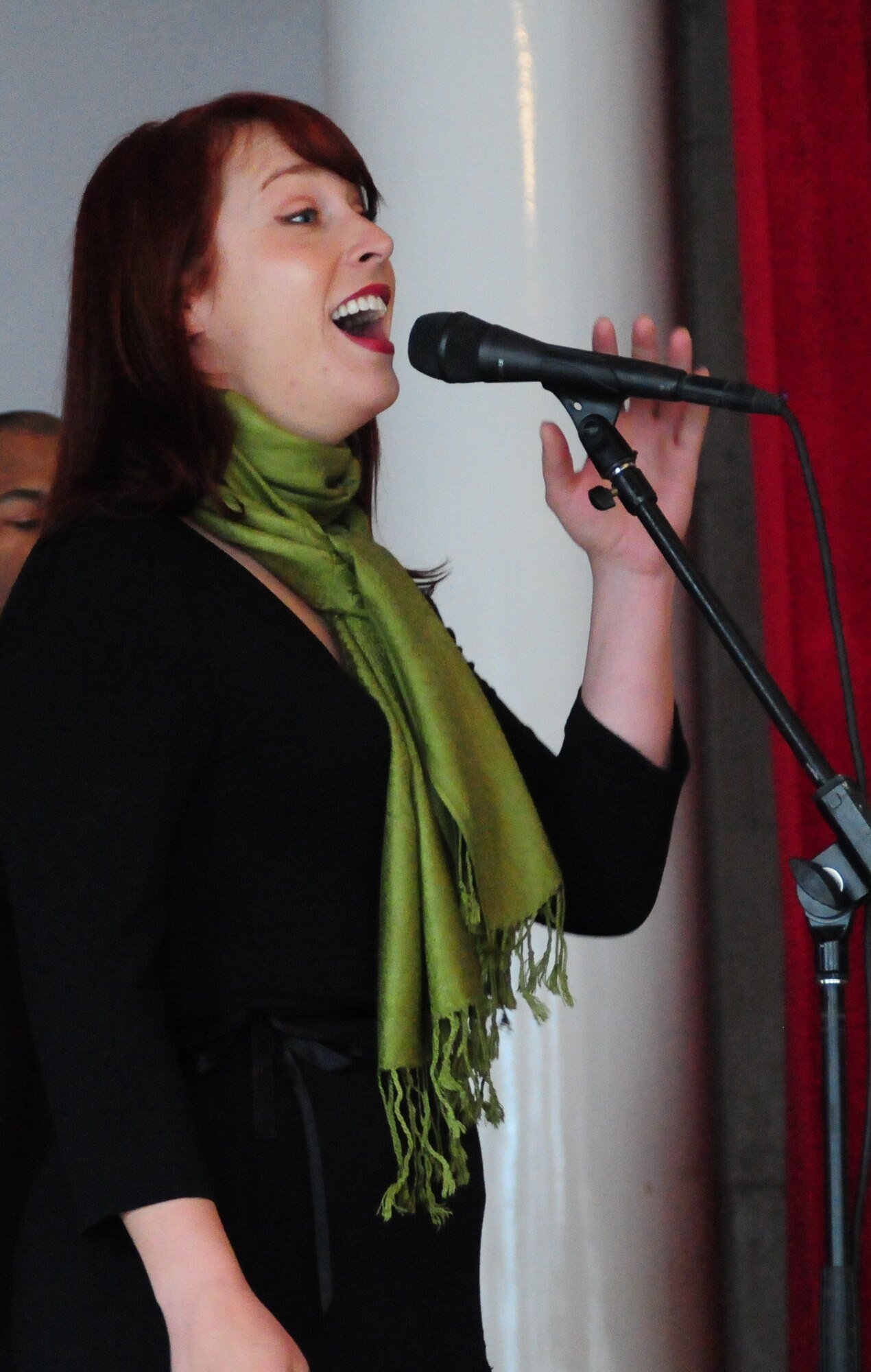 Airman 1st Class Jill Marie Diem, vocalist for the U.S. Air Forces Central Public Affairs band “Reserve Generation,” sings to the audience during a concert at the Kurenkeyev College of Music, Bishkek, Kyrgyzstan, March 5, 2010.  The band stopped at the Transit Center at Manas on a tour throughout the area of responsibility, where they perform for military members and civilians in the local area. (U.S. Air Force photo/Senior Master Sgt. Mike Litsey/Released)