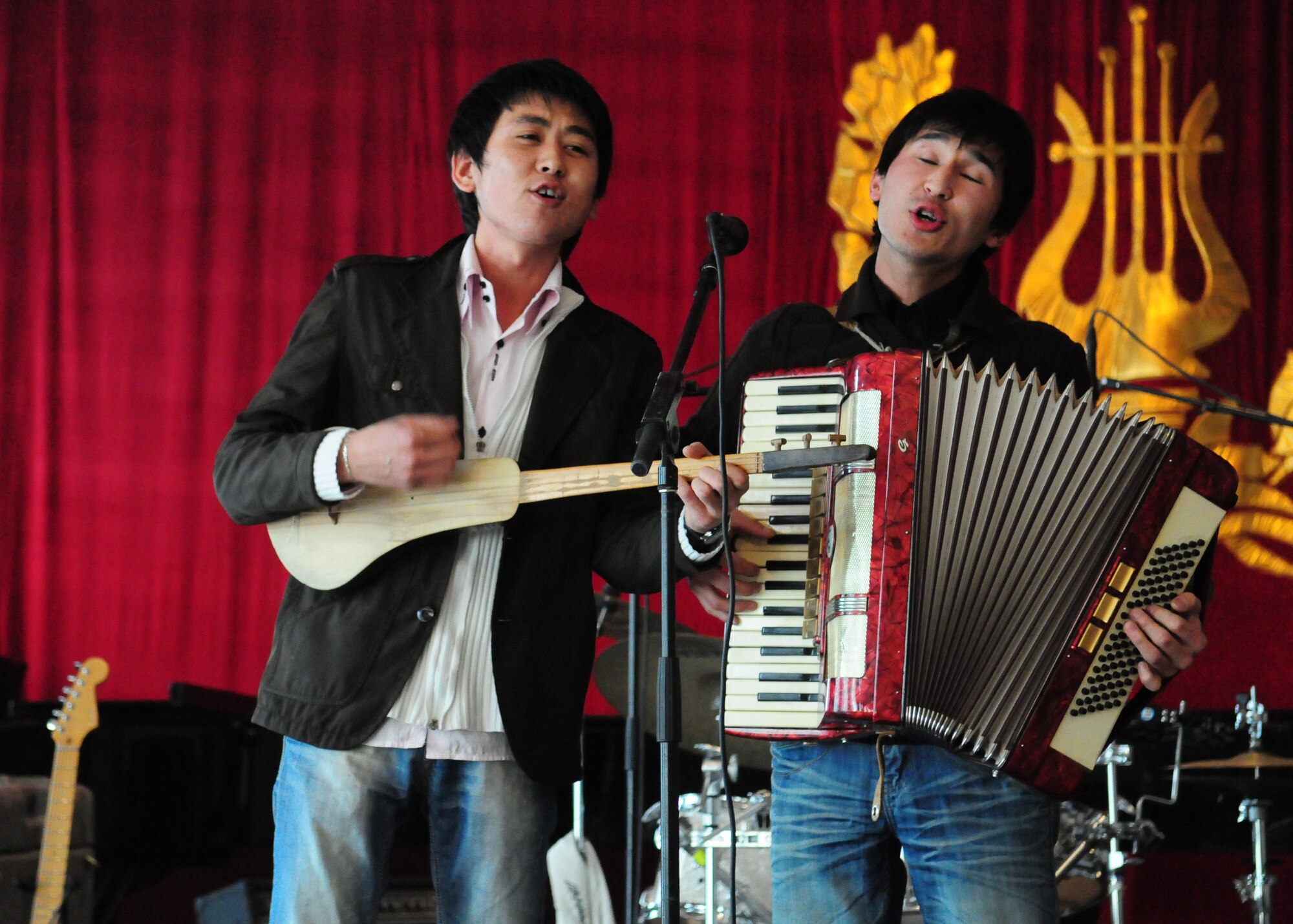Students from the Kurenkeyev College of Music perform after a concert by the U.S. Air Forces Central Public Affairs band “Reserve Generation” in Bishkek, Kyrgyzstan, March 5, 2010.  The band stopped at the Transit Center at Manas on a tour throughout the area of responsibility, where they perform for military members and civilians in the local area. (U.S. Air Force photo/Senior Master Sgt. Mike Litsey/Released)