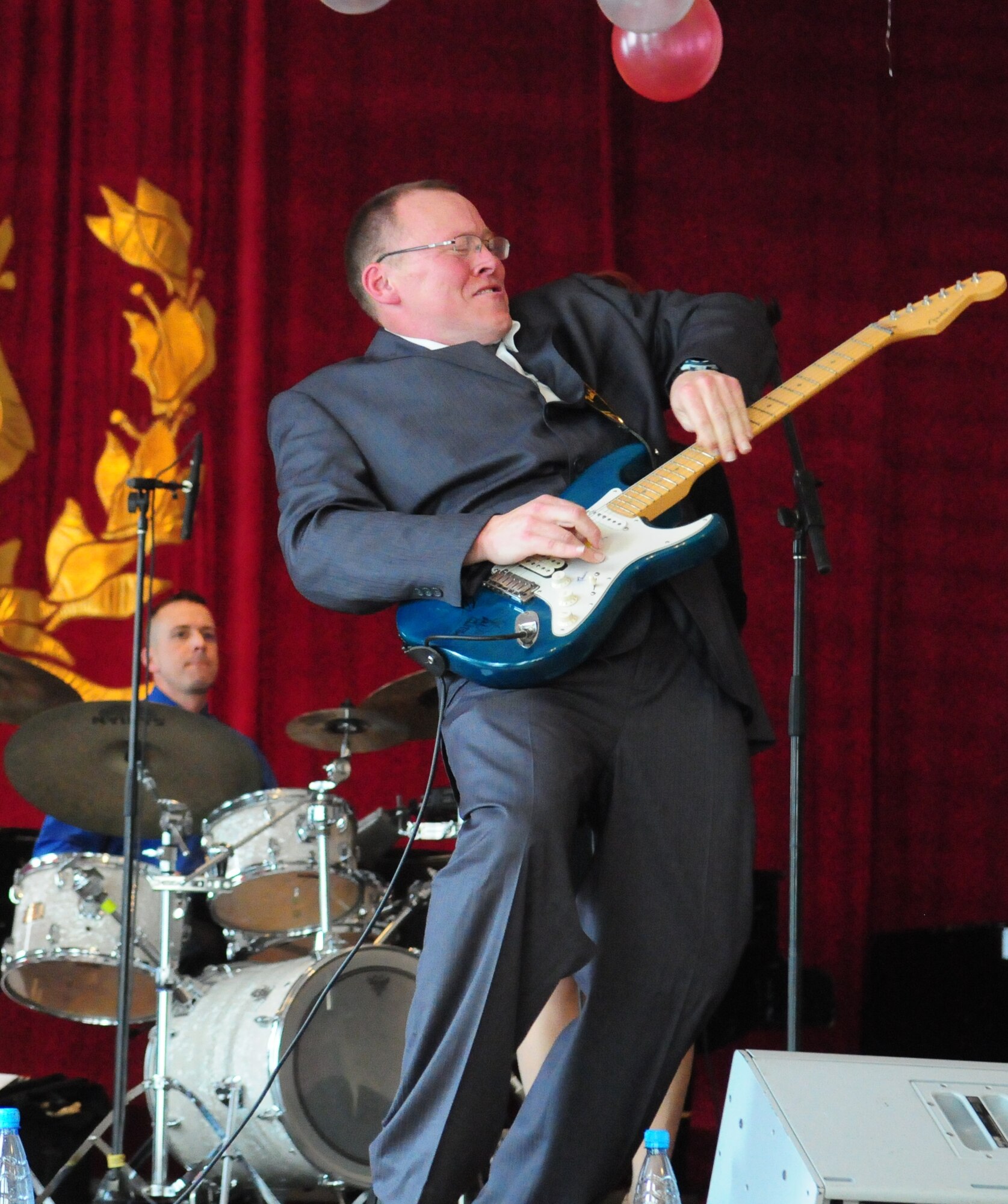 Senior Airman Josh Byrd, guitarist for the U.S. Air Forces Central Public Affairs band “Reserve Generation,” performs during a concert at the Kurenkeyev College of Music, Bishkek, Kyrgyzstan, March 5, 2010.  The band stopped at the Transit Center at Manas on a tour throughout the area of responsibility, where they perform for military members and civilians in the local area. (U.S. Air Force photo/Senior Master Sgt. Mike Litsey/Released) 