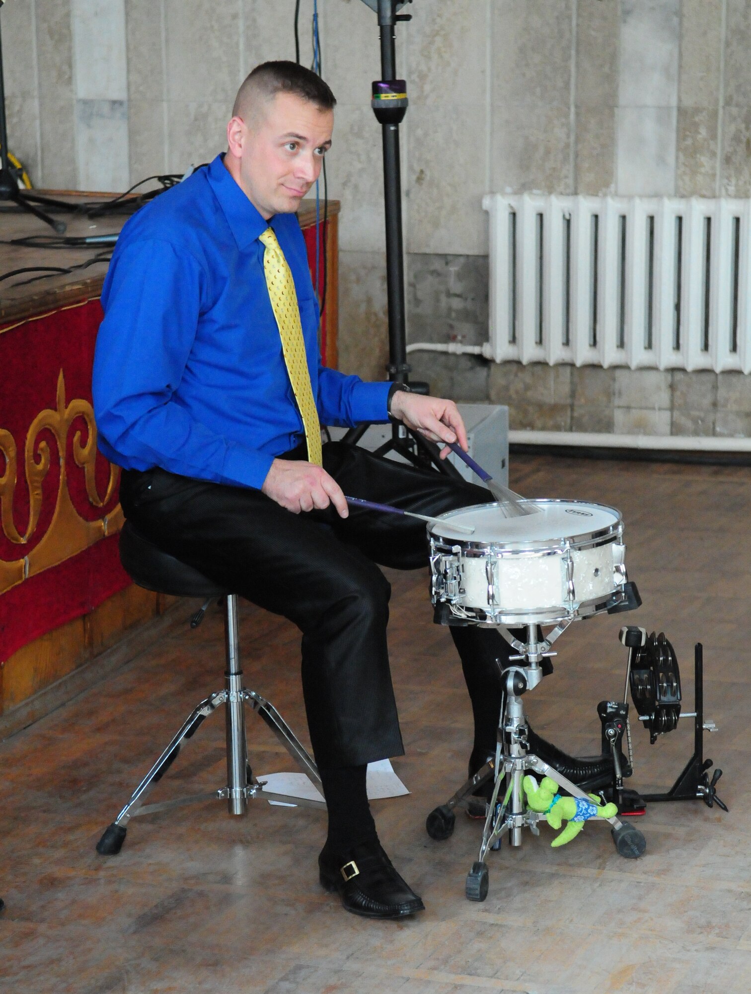 Tech. Sgt. David Vittetoe, percussionist of the U.S. Air Forces Central Public Affairs band “Reserve Generation,” plays a drum during a concert at the Kurenkeyev College of Music, Bishkek, Kyrgyzstan, March 5, 2010.  When an unexpected power outage knocked out their electrical equipment, Sergeant Vittetoe brought the drum off stage and continued performing to the delight of the audience. (U.S. Air Force photo/Senior Master Sgt. Mike Litsey/Released)