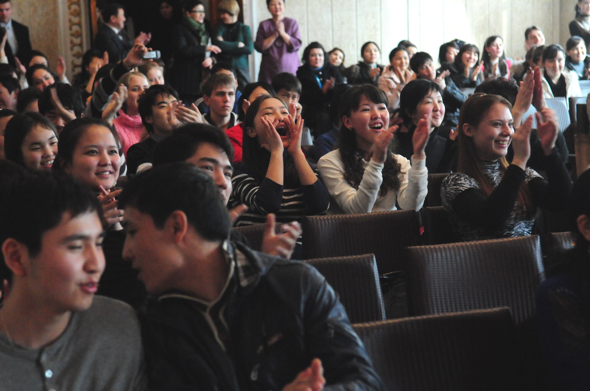 Audience members of the Kurenkeyev College of Music applaud the performance of the U.S. Air Forces Central Public Affairs band “Reserve Generation” during a concert in Bishkek, Kyrgyzstan, March 5, 2010.  The band stopped at the Transit Center at Manas on a tour throughout the area of responsibility, where they perform for military members and civilians in the local area. (U.S. Air Force photo/Senior Master Sgt. Mike Litsey/Released)