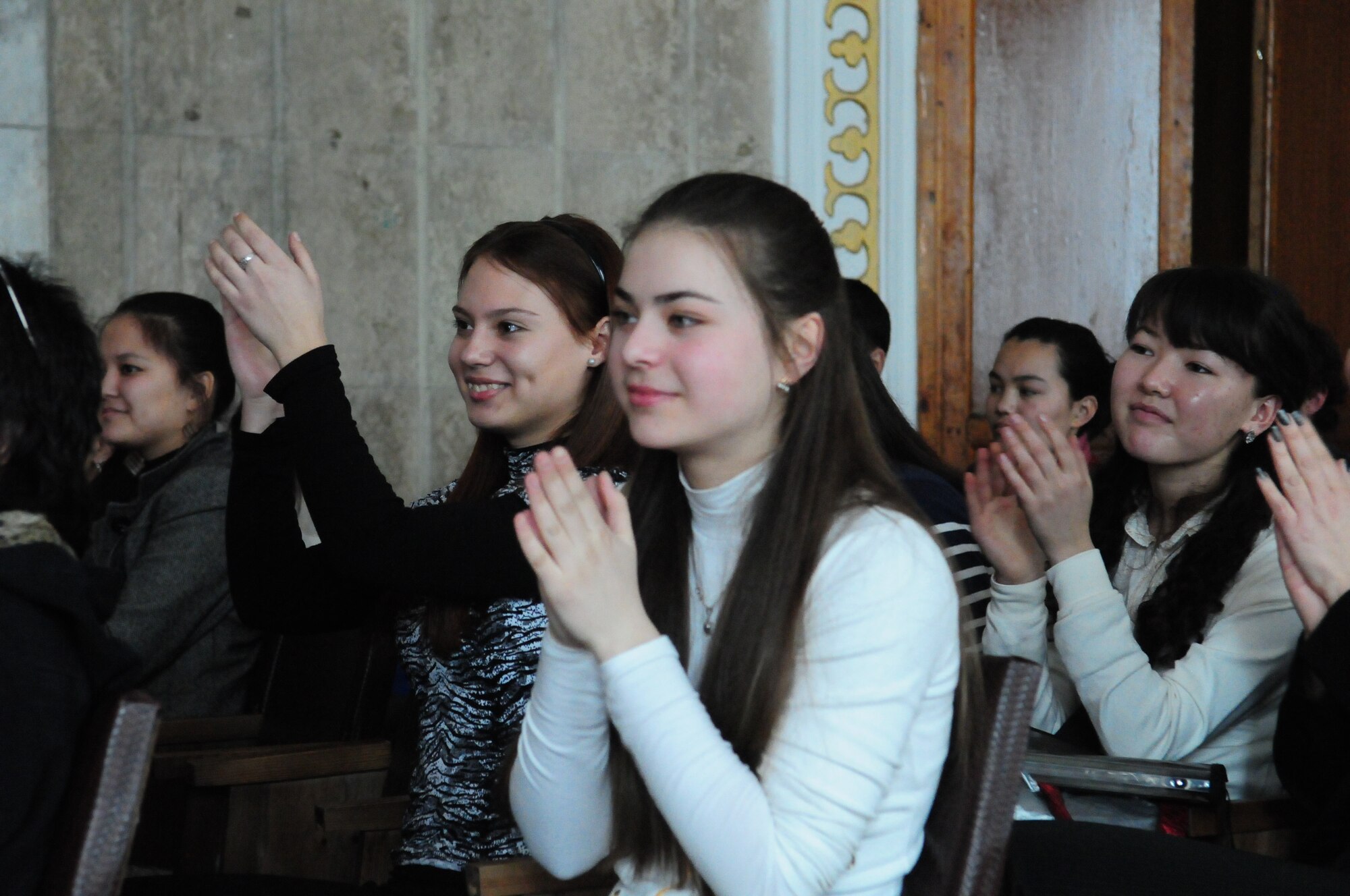 Audience members of the Kurenkeyev College of Music applaud the performance of the U.S. Air Forces Central Public Affairs band “Reserve Generation” during a concert in Bishkek, Kyrgyzstan, March 5, 2010.  The band stopped at the Transit Center at Manas on a tour throughout the area of responsibility, where they perform for military members and civilians in the local area. (U.S. Air Force photo/Senior Master Sgt. Mike Litsey/Released)