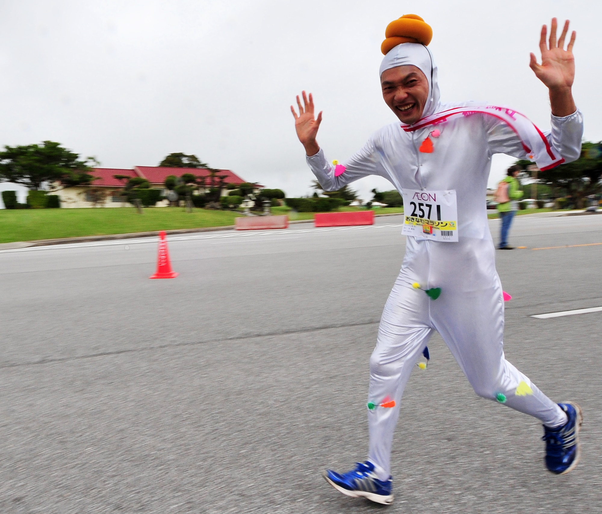Some runners made it worthwhile to dress up in costumes during the Okinawa Marathon March 7 at Kadena Air Base, Japan. Team Kadena volunteers encouraged and provided water to runners as they participated in the Kadena portion of the marathon. The marathon runs through nine different cities,towns,and villages in central Okinawa at a distance of 26.4 miles. The marathon aims to encourage people to enjoy running and increase their fitness level throughout Okinawa.  (U.S. Air Force photo/Tech. Sgt. Rey Ramon)       