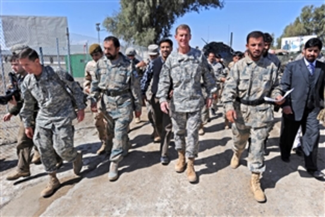 U.S. Army Gen. Stanley A. McChrystal, commander of the International Security Assistance Force and U.S. forces in Afghanistan, meets with Afghan Border Police Col. Abdul Razziq at the Wesh border crossing, Afghanistan, March 4, 2010. McChrystal and his staff are meeting with Razziq to discuss improvement plans for the border crossing.