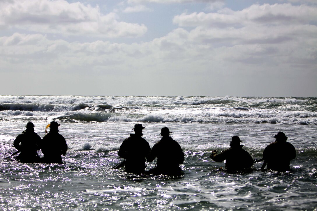 Marines with Company B, 1st Battalion, 7th Marine Regiment, make their way out to the ocean during a Basic Scout Swimmers Course training exercise at Naval Amphibious Base Coronado, Calif., March 9.