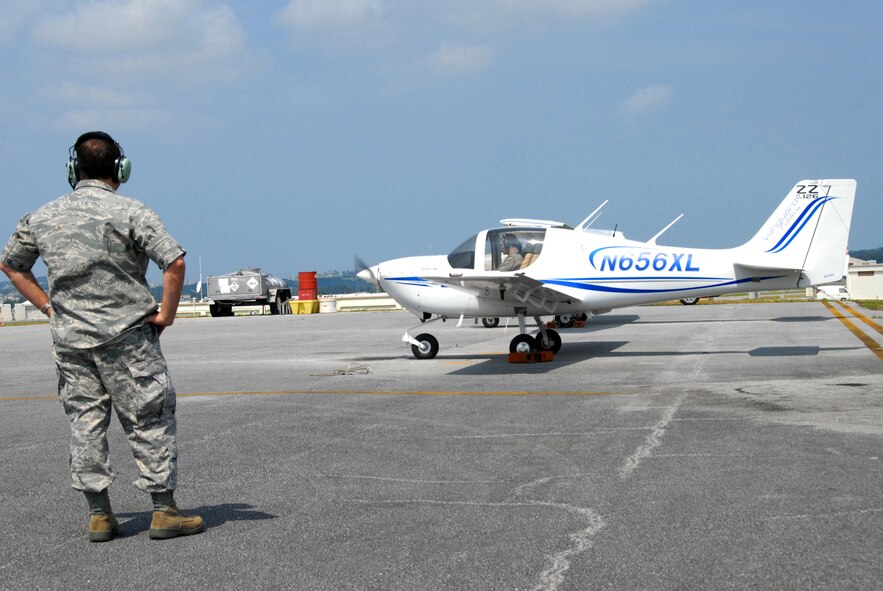 Brig. Gen. Ken Wilsbach, 18th Wing commander, prepares to taxi to the runway for the Liberty XL2's maiden flight as Col. Kelly Fletcher, 18th Mission Support Group commander,  looks on, March 3. The Kadena Aero Club recently acquired two new Liberty XL2s to augment their fleet of Cessna 172 aircraft. (U.S. Air Force photo/ Staff Sgt. Kenya Shiloh) (Released)

