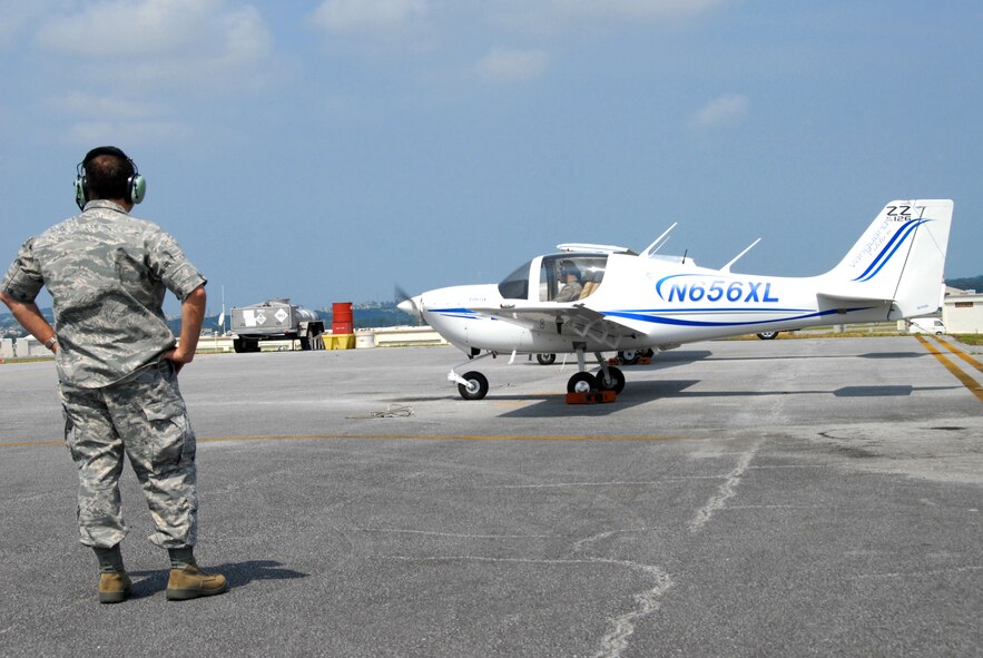 Brig. Gen. Ken Wilsbach, 18th Wing commander, prepares to taxi to the runway for the Liberty XL2's maiden flight as Col. Kelly Fletcher, 18th Mission Support Group commander,  looks on, March 3. The Kadena Aero Club recently acquired two new Liberty XL2s to augment their fleet of Cessna 172 aircraft. (U.S. Air Force photo/ Staff Sgt. Kenya Shiloh) (Released)

