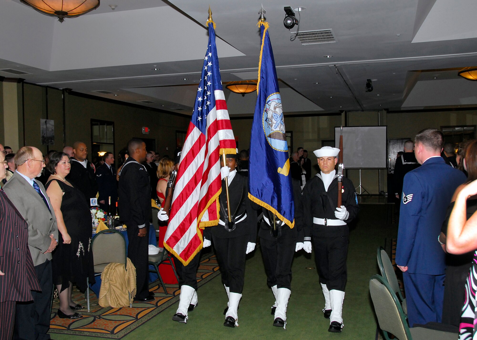 The Navy Color Guard presents the flags during the 68th Annual Seabee Ball in Wichita Falls, Texas, March 5. Retired Lt. Cmdr. Earl Ramsey, the first officer in charge of the Detachment Sheppard Naval Construction Training Center, shared his life experiences at with the audience to celebrate the SeaBee birthday.  (U.S. Air Force photo/Harry Tonemah)