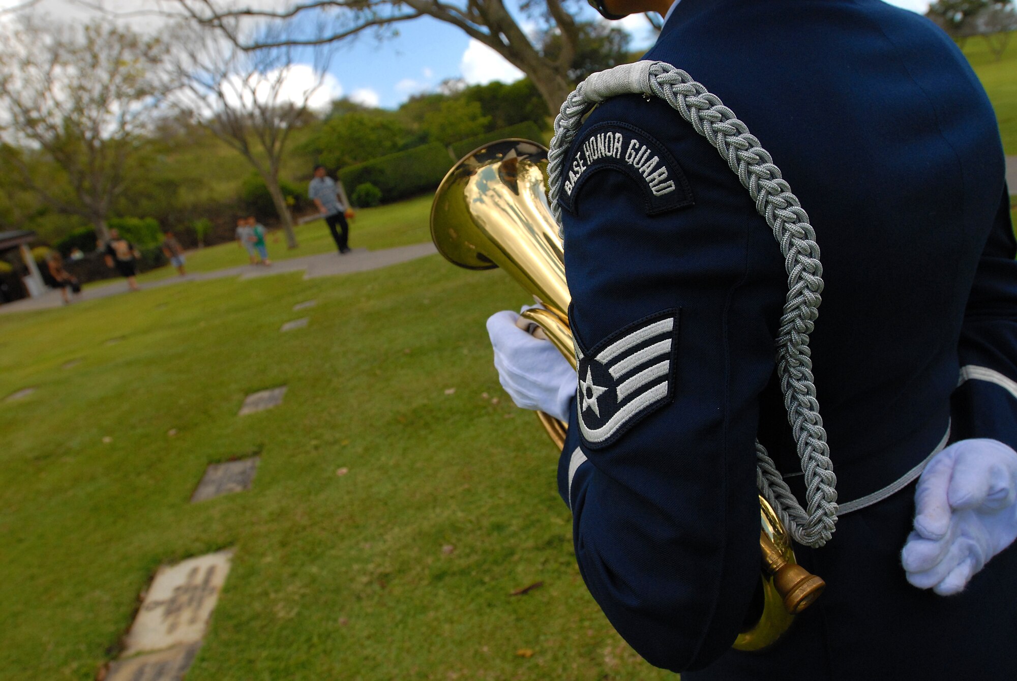 HONOLULU -- Staff Sgt. Renee Torres, 15th Airlift Wing Honor Guard, waits for all family members of a veteran's funeral ceremony at the National Memorial Cemetery of the Pacific March 3. The Hickam Honor Guard has the responsibility of representing the United States Air Force throughout the Hawaiian Islands as friends and family gather to pay their final respects to their loved ones that have honorably served their country.(U.S. Air Force photo/Staff Sgt. Mike Meares)