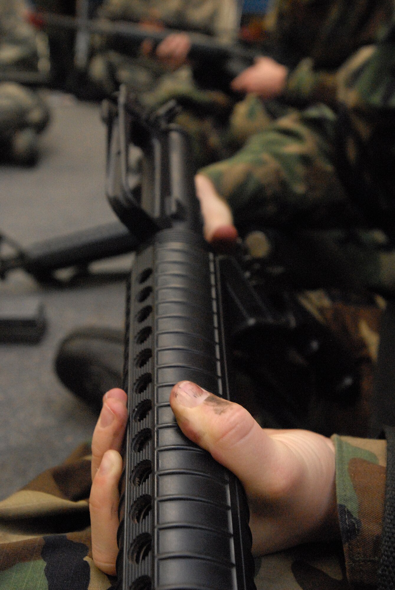 GOODFELLOW AIR FORCE BASE, Texas - A cadet with Air Force Reserve Officer Training Corps Detachment 847, Angelo State University, San Angelo, Texas, pays attention to instruction on reassembling the M16A2 during a weapons familiarization class at Goodfellow AFB, Texas, March 6, 2010.  The 17th Training Wing hosted cadets from Detachment 847 for 2 days during which cadets participated in class room instruction, field training and a deployment exercise at Goodfellow AFB’s Forward Operating Base Sentinel. (U.S. Air Force photo/Master Sgt Randy Mallard)