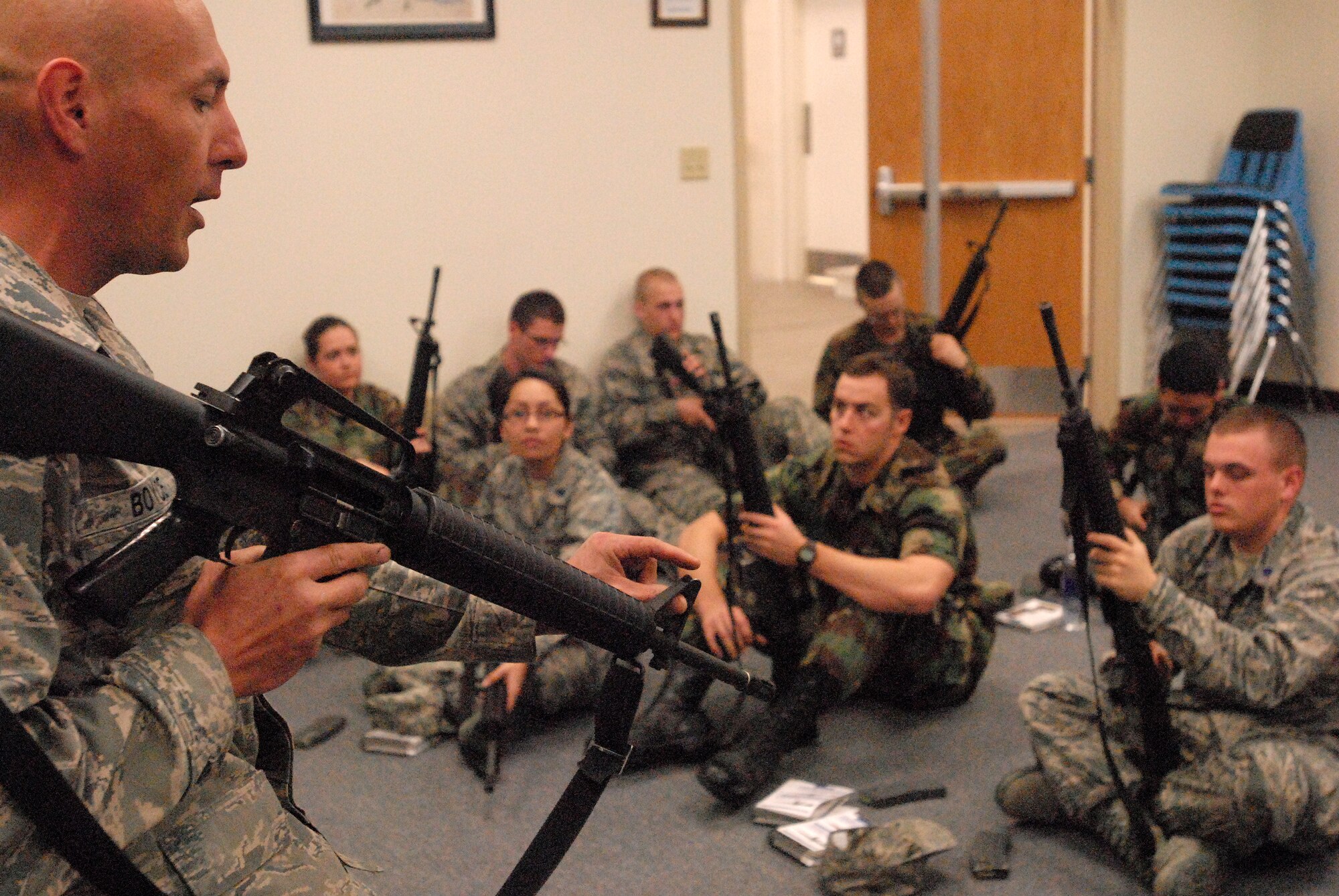 GOODFELLOW AIR FORCE BASE, Texas - Tech. Sgt Kevin Boyce, a member of the 17th Security Forces Squadron, Goodfellow, AFB, Texas, goes over the different parts of the M16A2 with cadets from Air Force Reserve Officer Training Corps Detachment 847, Angelo State University, San Angelo, Texas, March 6, 2010.  The 17th Training Wing hosted cadets for 2 days during which cadets participated in class room instruction, field training and a deployment exercise at Goodfellow’s Forward Operating Base Sentinel. (U.S. Air Force photo/Master Sgt Randy Mallard)