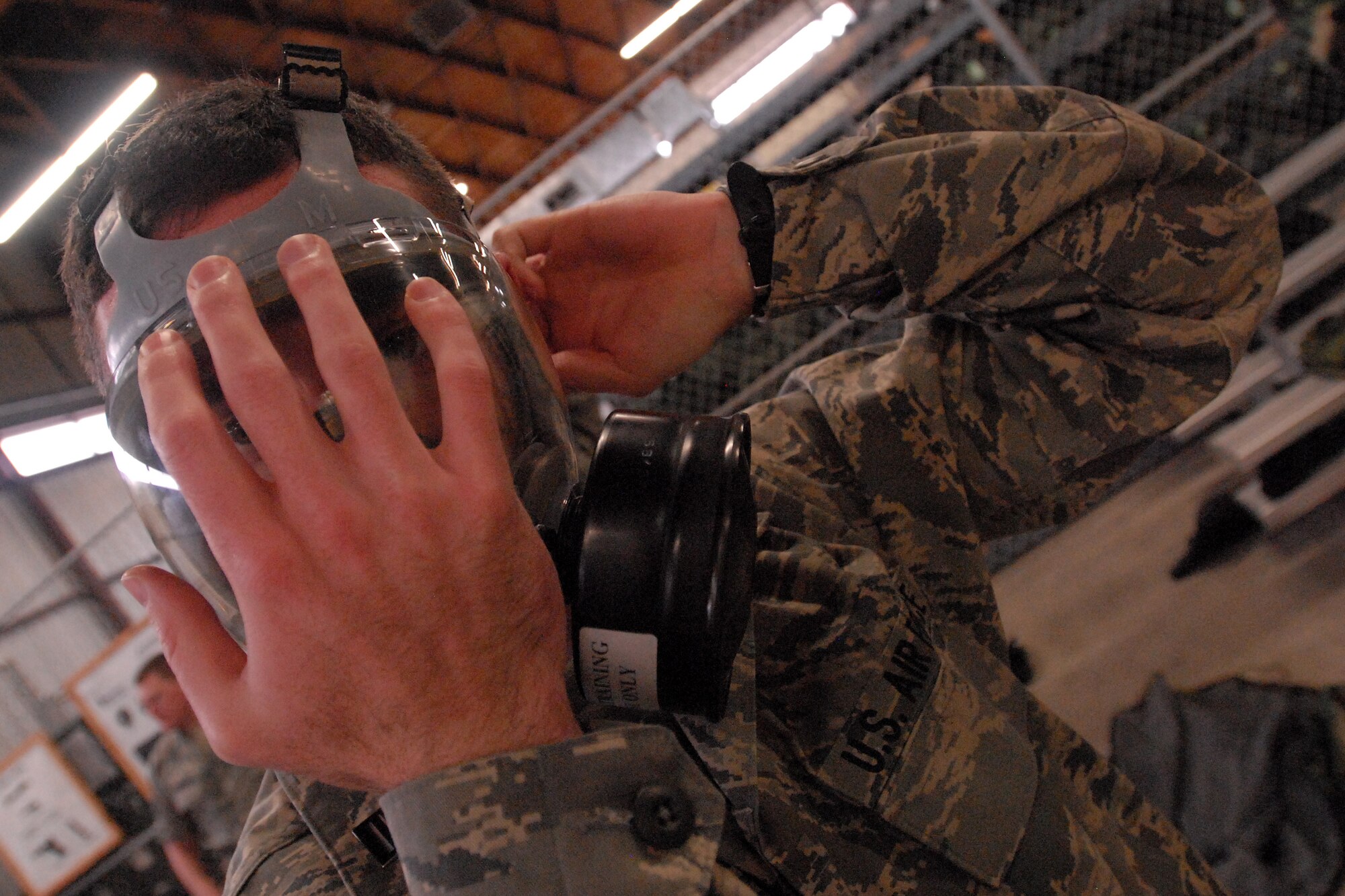 GOODFELLOW AIR FORCE BASE, Texas - A cadet from the Air Force Reserve Officer Training Corps Detachment 847, Angelo State University, San Angelo, Texas, fits a MCU-2 Protective Mask to his face during a training class, March 5, 2010. The 17th Training Wing hosted cadets from Detachment 847, for 2 days during which cadets participated in class room instruction, field training and a deployment exercise at Goodfellow’s Forward Operating Base Sentinel. (U.S. Air Force photo/Master Sgt Randy Mallard)