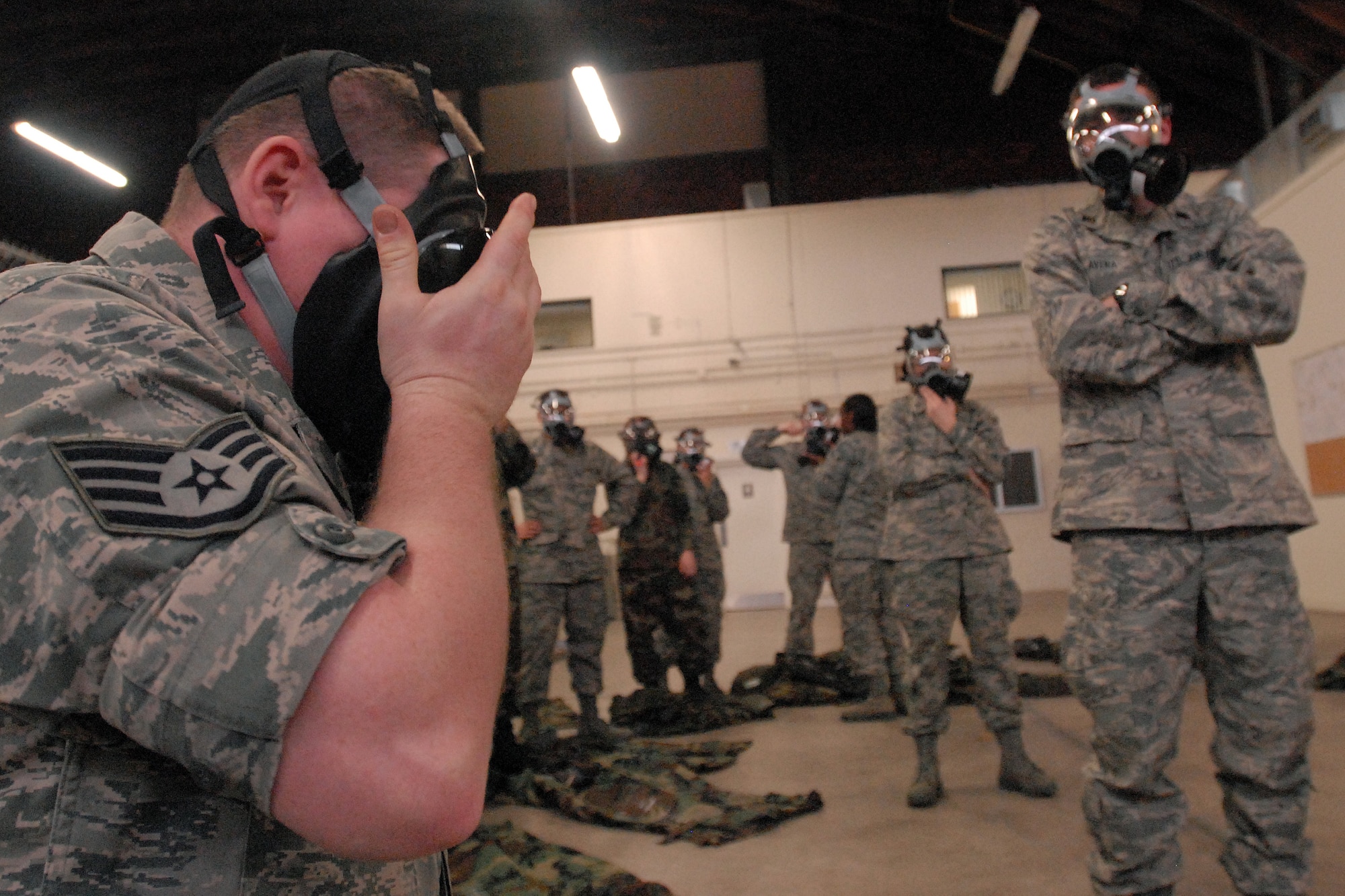 GOODFELLOW AIR FORCE BASE, Texas - Staff Sgt. Kevin Rodgers, 17th Civil Engineering Squadron, Goodfellow AFB, Texas, demonstrates the speed at which an individual can don a MCU-2 protective mask for ROTC cadets, March 5, 2010. The 17th Training Wing hosted cadets from Air Force Reserve Officer Training Corps Detachment 847, Angelo State University, San Angelo, Texas, for 2 days during which cadets participated in class room instruction, field training and a deployment exercise at Goodfellow’s Forward Operating Base Sentinel. (U.S. Air Force photo/Master Sgt Randy Mallard)