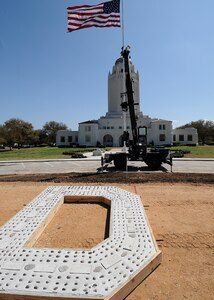 A new letter "D" takes it's place in Washington Circle March 9 during a project to replace some of the aging letters spelling "Randolph Field," which were originally installed in the 1930s. (U.S. Air Force photo by David Terry)