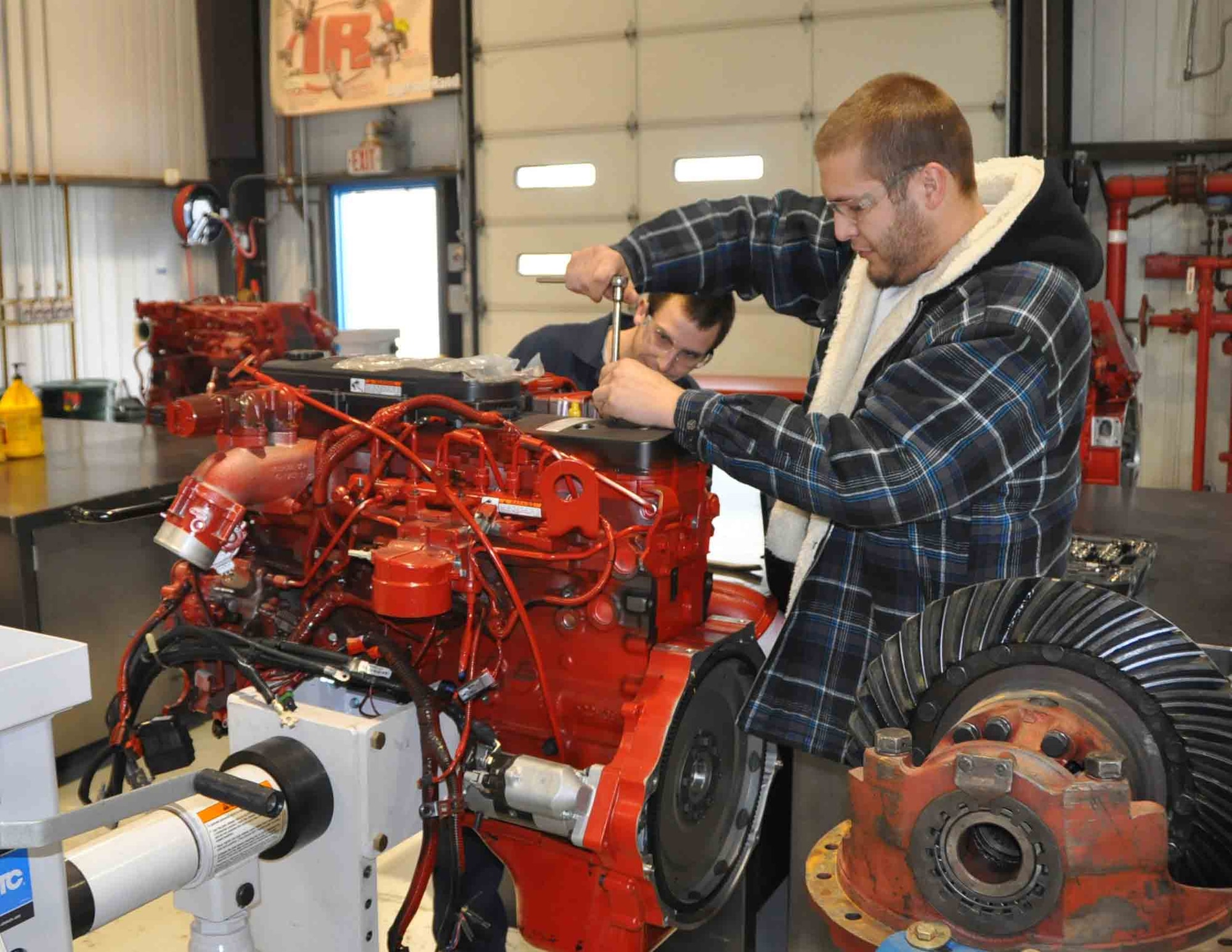 Both students are enrolled in American River College's clean diesel technology program at the former Mather Air Force Base in Sacramento, Calif. (Photo by Wojciech Betlej)