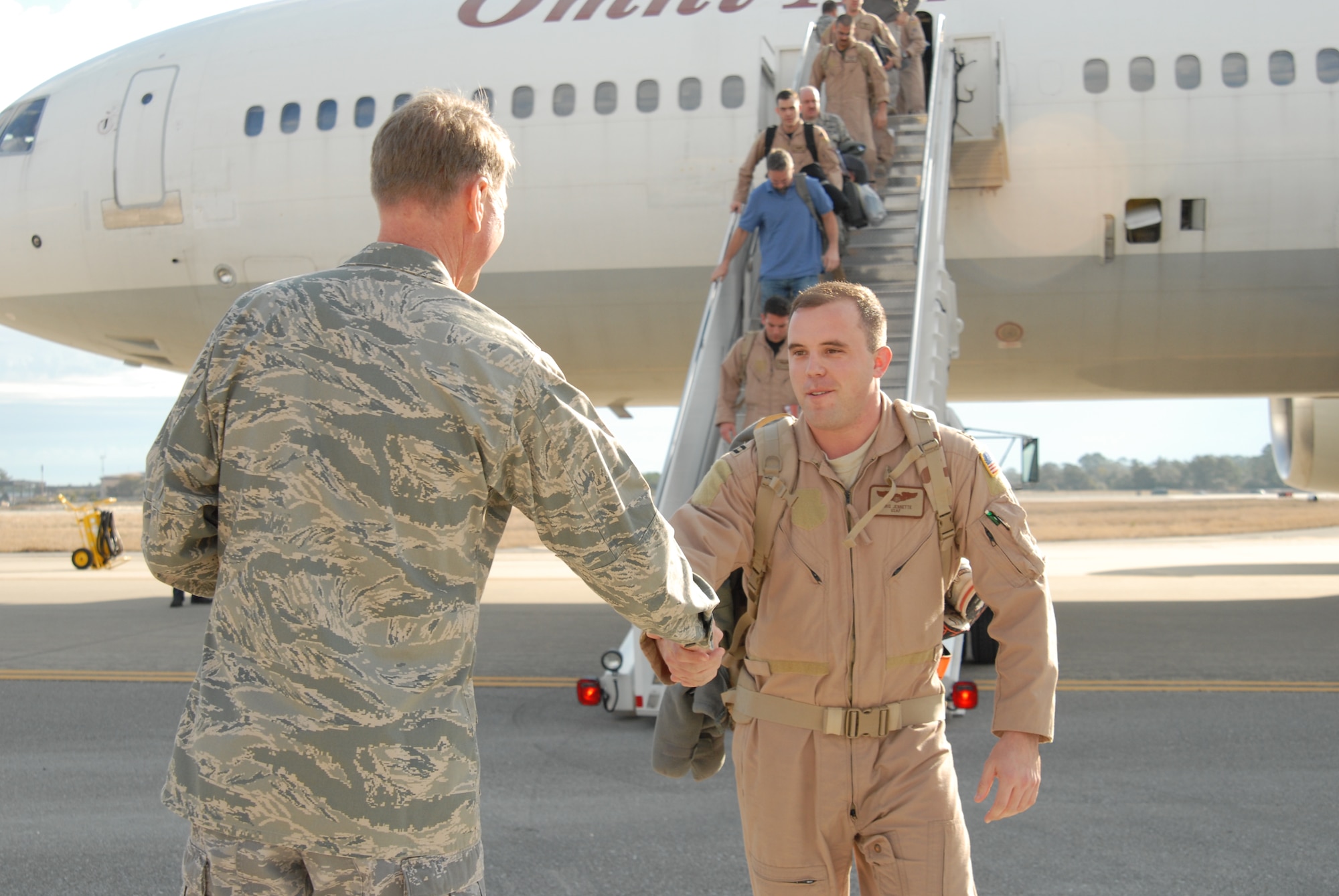 U. S. Air Force Col. Thomas Jackson, deputy commander, 1st Special Operations Maintenance Group, greets Capt. Christopher Jennette, 4th Special Operations Squadron, after he and other Airmen assigned to Hurlburt Field return home from various deployment locations in Southwest Asia, Hurlburt Field, Fla., Mar. 9, 2010.  (U. S. Air Force photo by Staff Sgt. Orly N. Tyrell/RELEASED)