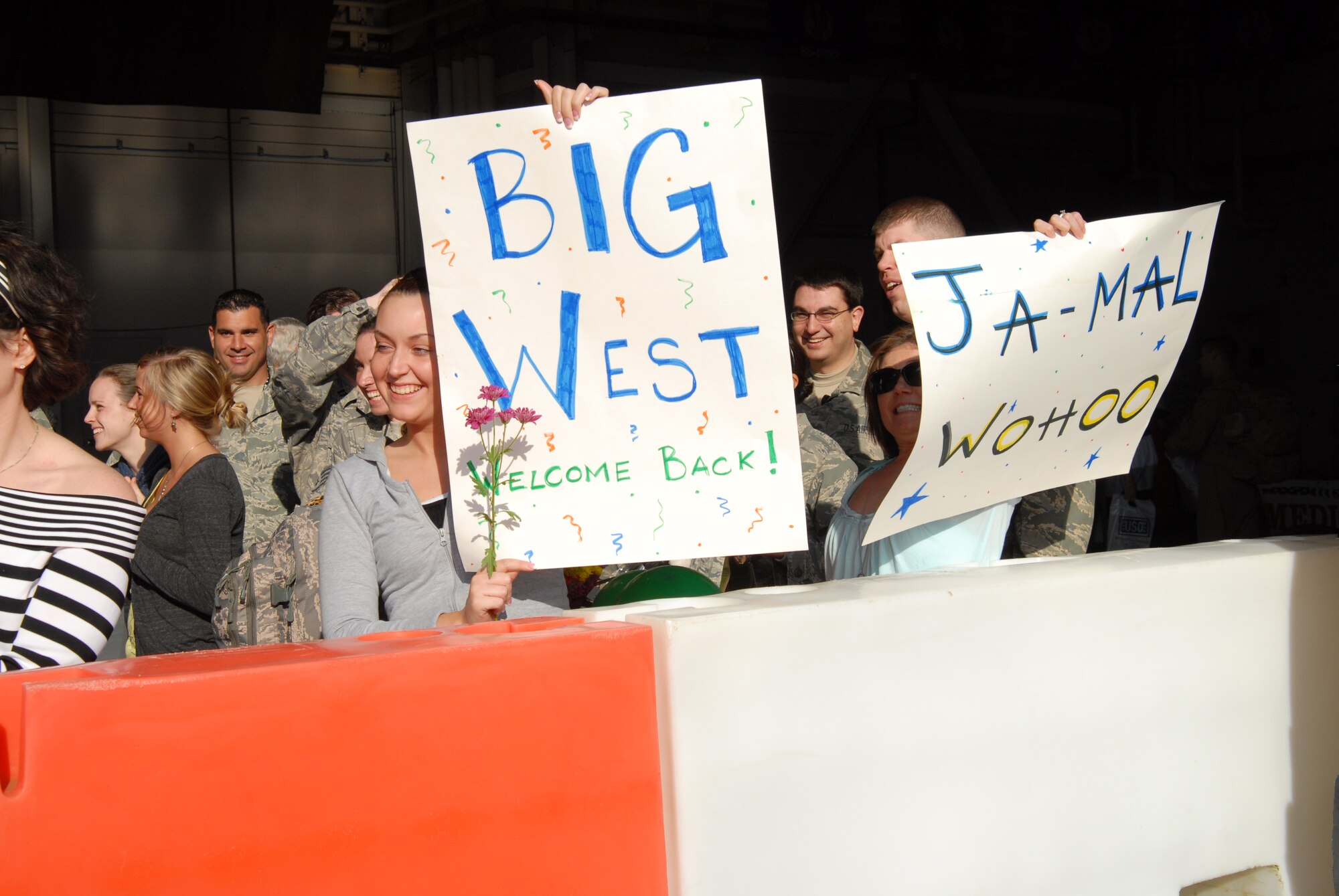 Friends and family members celebrate the arrival of their loved ones redeploying from various locations in Southwest Asia during Hurlburt Field's Operation Homecoming Ceremony at Hurlburt Field, Fla., Mar. 9, 2010.  (U. S. Air Force photo by Staff Sgt. Orly N. Tyrell/RELEASED)