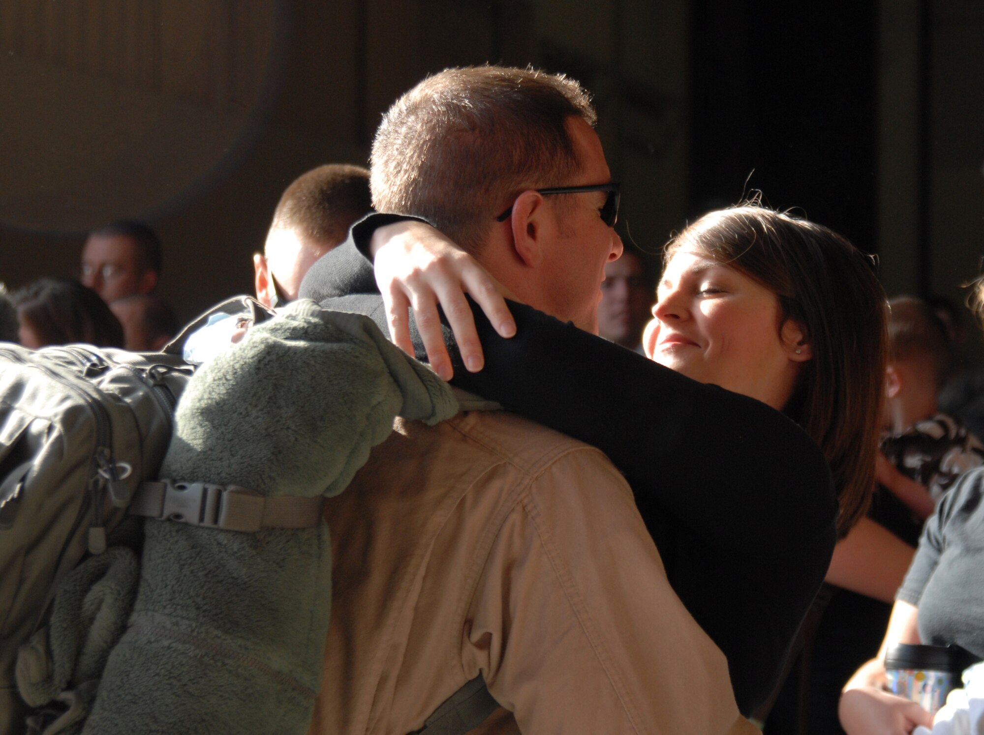 U. S. Air Force Tech. Sgt. Joshua Huston, 25th Intelligence Squadron, embraces his wife Tiffany, at Hurlburt Field's  Operation Homecoming Ceremony, Hurlburt Field, Fla., Mar. 9, 2010.  Sergeant Huston and other Airmen assigned to Hurlburt Field are redeploying from various locations in Southwest Asia. (U. S. Air Force photo by Staff Sgt. Orly N. Tyrell/RELEASED)