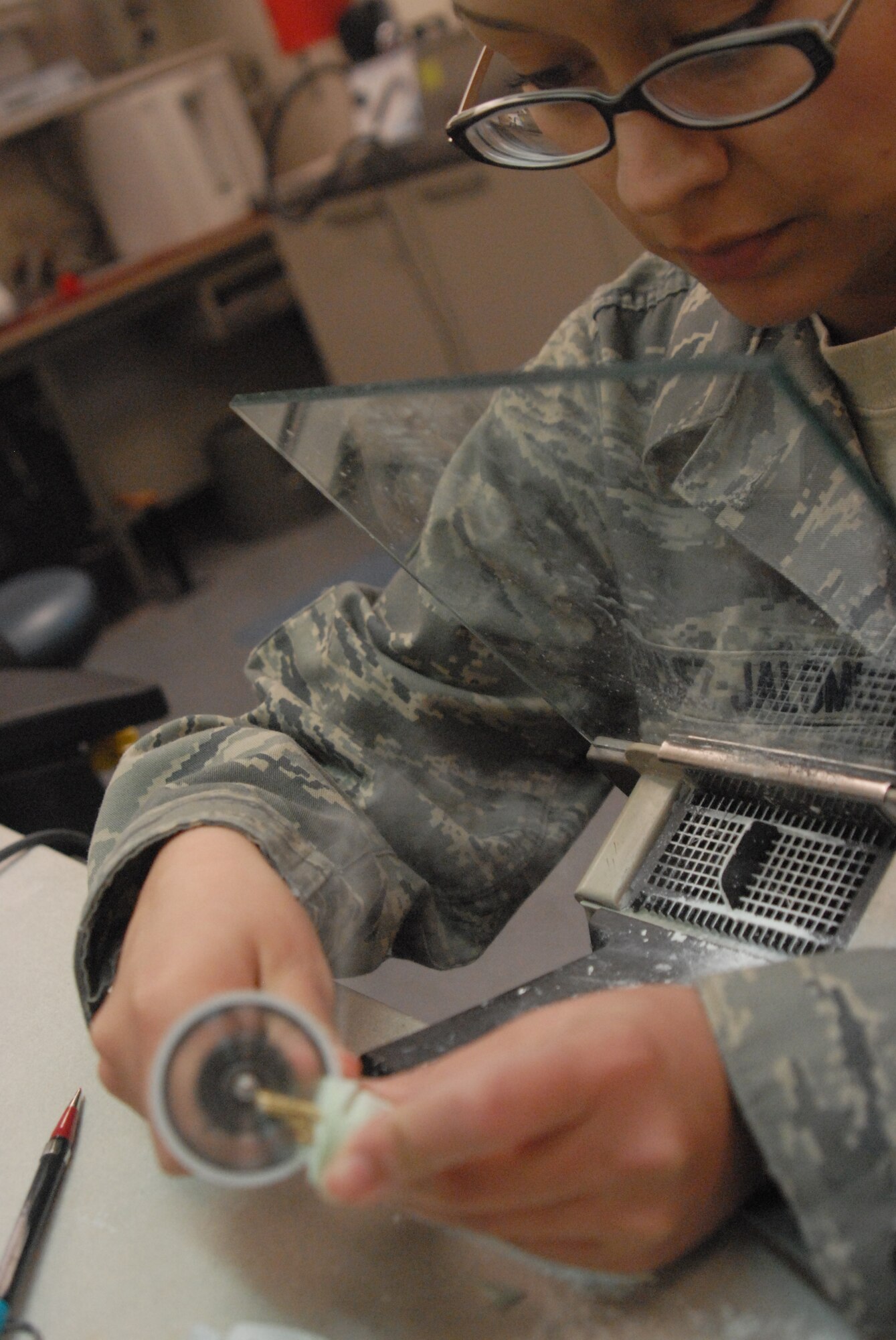 Senior Airman Evelyn Sanchez-Jalomo, 17th Medical Operations Squadron, works on a cast. Dental laboratory technicians are highly trained in making crowns,
bridges, dentures, and any supplemental appliances. They not only have a strong understanding of dental materials and their properties but have high dexterity in making the appliances look amazingly natural. (U.S. Air Force photo/Airman 1st Class Anne Gathua)
