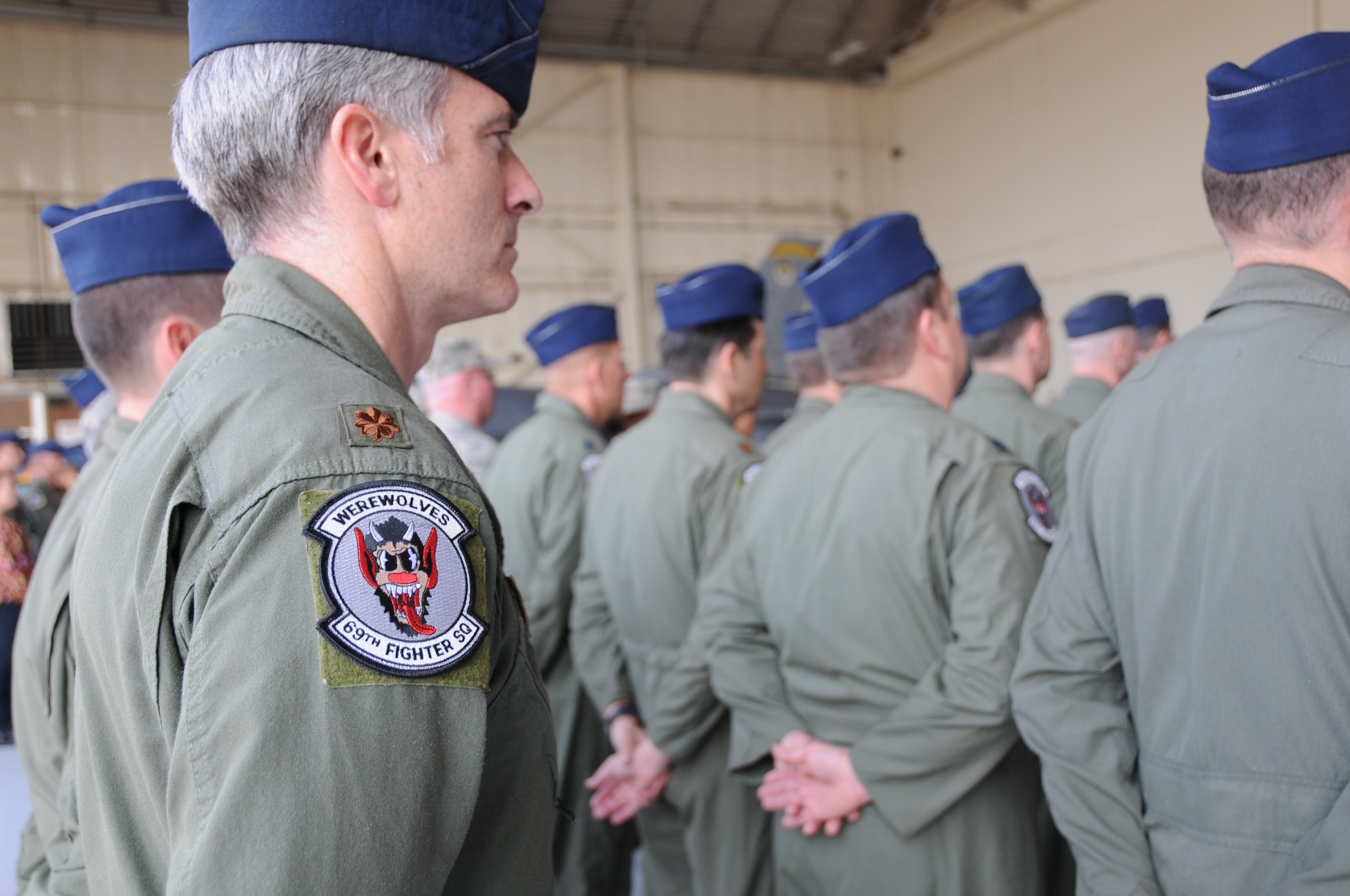 The pilots of the 301st Fighter Squadron changed their patch to the 69th Fighter Squadron during a ceremony March 5. The 301st FS, which traces its roots to the Tuskegee Airmen of World War II, will continue its legacy with the next generation aircraft, the F-22 Raptor, at Holloman Air Force Base, N.M., as a Reserve associate unit. The 69th FS pilots will continue their reserve associate pilot training program with the 56th Fighter Wing here at Luke. (U.S. Air Force photo/Tech. Sgt. Susan
Stout)
