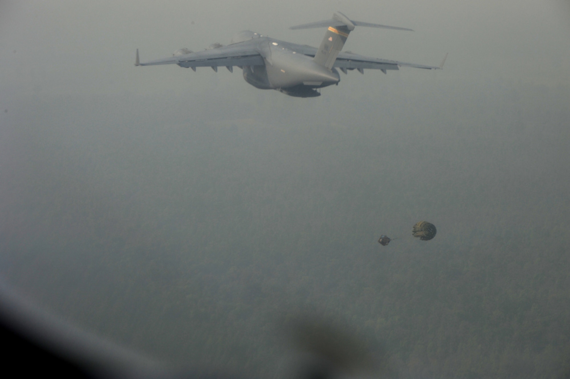 Simulated cargo is ejected from the back of a C-17 Globemaster III from Joint Base Pearl Harbor Hickam, Hawaii, during an airdrop training mission supporting Cope Tiger 2010 in Thailand on March 8. Cope Tiger is an annual multilateral exercise conducted in Thailand that includes humanitarian and civic assistance programs. This year's exercise takes place primarily at Udon Thani and Korat Royal Thai Air Force Bases March 1 to 12. (U.S. Air Force photo/Tech. Sgt. Cohen A. Young)