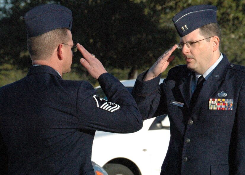 Air Force Reserve Capt. Jon Connerton, 919th Mission Support Flight commander, returns a salute from one of his Airmen during a unit training assembly open ranks inspection at Duke Field March 6.   The 919th Special Operations Wing's units periodically hold such inspections to reinforce esprit de corps, uniform wear and appearance standards as well as other time-honored military customs and traditions.  (U.S. Air Force photo/Dan Neely)