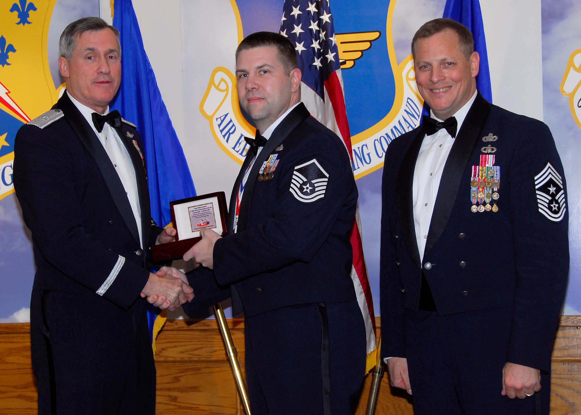 Brig. Gen. O.G. Mannon, 82nd Training Wing commander, presents Master Sgt. William Aronowitz, 82nd Mission Support Group, with the Associate First Sergeant of the Year award March 5 during the 2009 82nd TRW Annual Awards banquet. Also pictured is wing Command Chief, Chief Master Sgt. Kenneth Sallinger. (U.S. Air Force photo/Harry Tonemah) 
