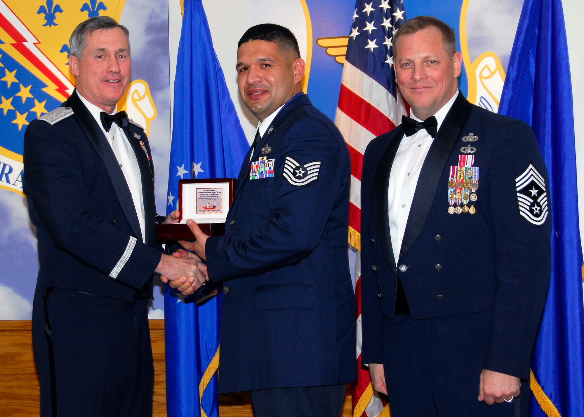 Brig. Gen. O.G. Mannon, 82nd Training Wing commander, presents Tech. Sgt. Angel Armendariz, 364th Training Squadron, with the NCO of the Year award March 5 during the 2009 82nd TRW Annual Awards banquet. Also pictured is wing Command Chief, Chief Master Sgt. Kenneth Sallinger. (U.S. Air Force photo/Harry Tonemah) 