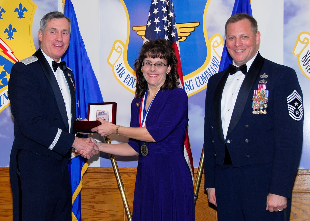 Brig. Gen. O.G. Mannon, 82nd Training Wing commander, presents Marta Garcia, 82nd Dental Squadron, with the Civilian Category I of the Year award March 5 during the 2009 82nd TRW Annual Awards banquet. Also pictured is wing Command Chief, Chief Master Sgt. Kenneth Sallinger. (U.S. Air Force photo/Harry Tonemah) 