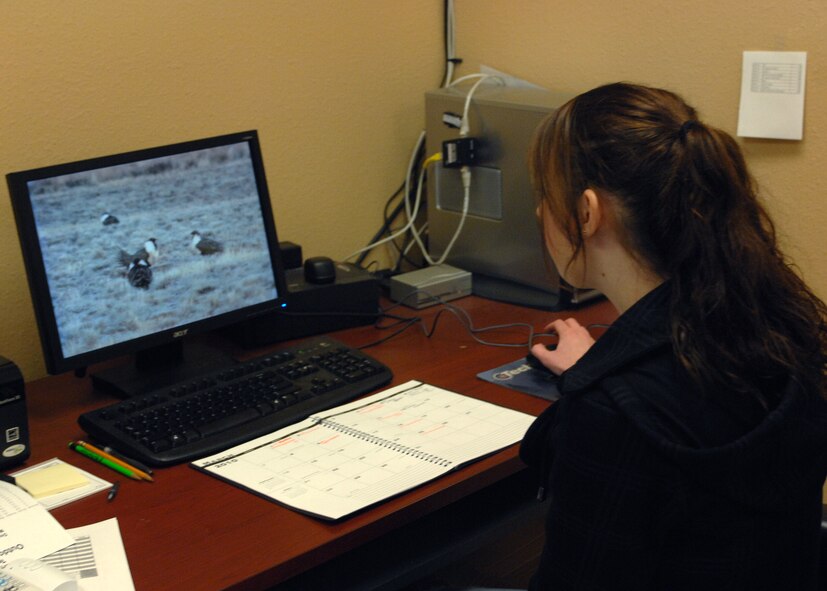 MINOT AIR FORCE BASE N.D. – Sarah Simpson, 5th Force Support Squadron outdoor recreation aid, operates the computer system for the virtual archery range at the outdoor recreation center March 8. The outdoor recreation center received the virtual range last September and is currently holding a league competition which began March 1.  The nine-week league will conclude April 24, with a trophy going to the top two-person team. (U.S. Air Force photo by Airman 1st Class Aaron-Forrest Wainwright)