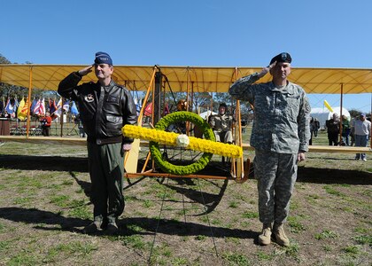 Saluting after laying a wreath to mark the 100th Anniversary of Miliitary Aviation are U.S. Air Force General Stephen Lorenz, left, Air Education and Training Command commander and Army Maj. Gen. Russell Czerw, Fort Sam Houston commander. The anniversary celebration of military aviation featured a display of a reproduction Wright Flyer aircraft at Fort Sam Houston, Texas, and a flyover of another more air worthy model of the aircraft flown by the Wright Brothers at Kitty Hawk . On March 2, 1910 Army Lt. Benjamin Foulois made the first military flight at Fort Sam Houston in a Wright Flyer. (U.S. Air Force photo by Dave Terry)