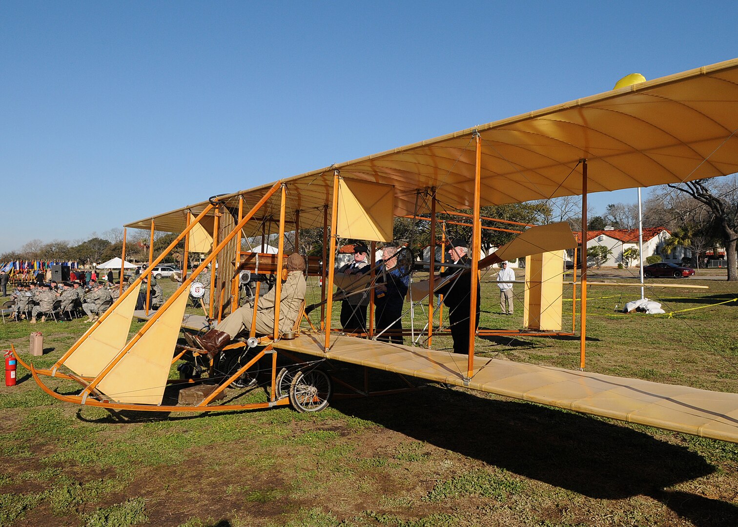 Pilot Don Gum is at the controls of a Wright Flyer "Yellow Bird" prior to a powered taxi on the parade grounds of Fort Sam Houston, Texas. The March 2 display marked the 100th Anniversary of Military Aviation. On March 2, 1910 Army Lt. Benjamin Foulois took off in a Wright Flyer, from the same parade ground, on the first military flight. (U.S. Air Force photo by Dave Terry)