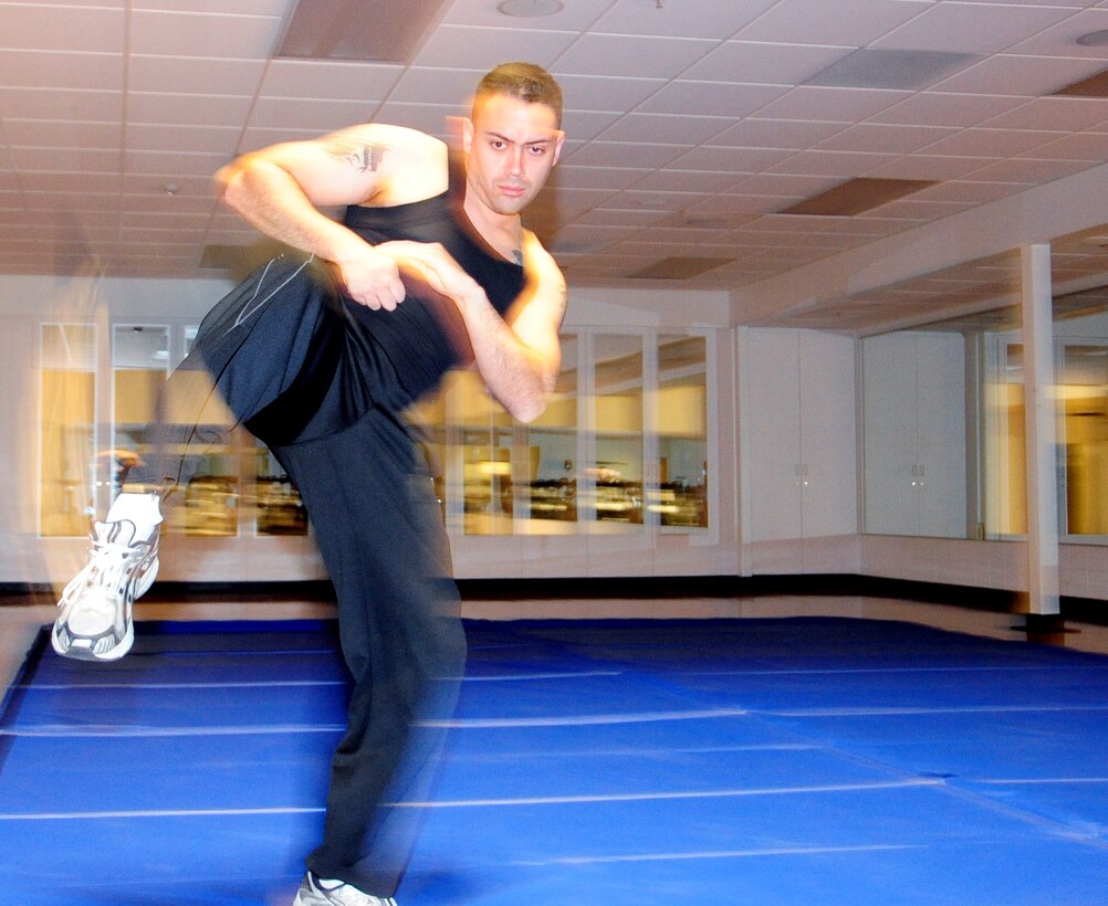 ELLSWORTH AIR FORCE BASE, S.D. -- Airman 1st Class Jarad Denton, 28th Bomb Wing public affairs staff writer, stretches before teaching a self-defense class focused on real-life situations, March 5.  "We want participants to understand that the danger exists, how to avoid those kind of situations and if necessary-defend themselves from attacks," Airman Denton said . (U.S. Air Force photo/Airman 1st Class Anthony Sanchelli)
