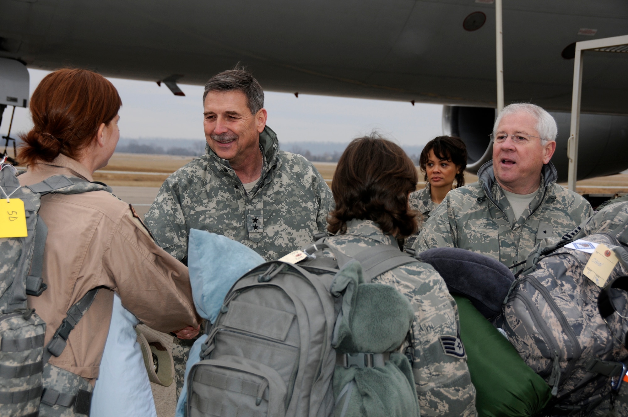 Maj. Gen. William Wofford, Adjutant General for the Arkansas National Guard, left, and Brig. Gen. Riley Porter, Arkansas Air National Guard commander, right, shakes hands with members of the 188th Fighter Wing in Fort Smith, Ark., March 8, 2010. The 188th deployed more than 200 Airmen to Kandahar, Afghanistan as part of the unit's Aerospace Expeditionary Forces rotation. This will mark the 188th's first combat deployment in the A-10 Thunderbolt II "Warthog." (U.S. Air Force photo by Technical Sgt. Stephen M. Hornsey/188th Fighter Wing Public Affairs)