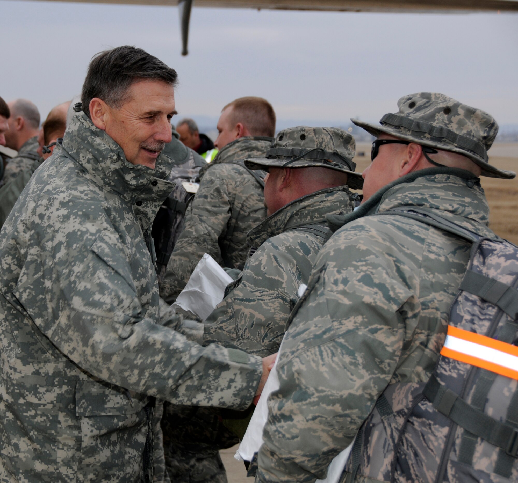Maj. Gen. William Wofford, Adjutant General for the Arkansas National Guard, shakes hands with members of the 188th Fighter Wing in Fort Smith, Ark., March 8, 2010. The 188th deployed more than 200 Airmen to Kandahar, Afghanistan as part of the unit's Aerospace Expeditionary Forces rotation. This will mark the 188th's first combat deployment in the A-10 Thunderbolt II "Warthog." (U.S. Air Force photo by Technical Sgt Stephen M. Hornsey/188th Fighter Wing Public Affairs)
