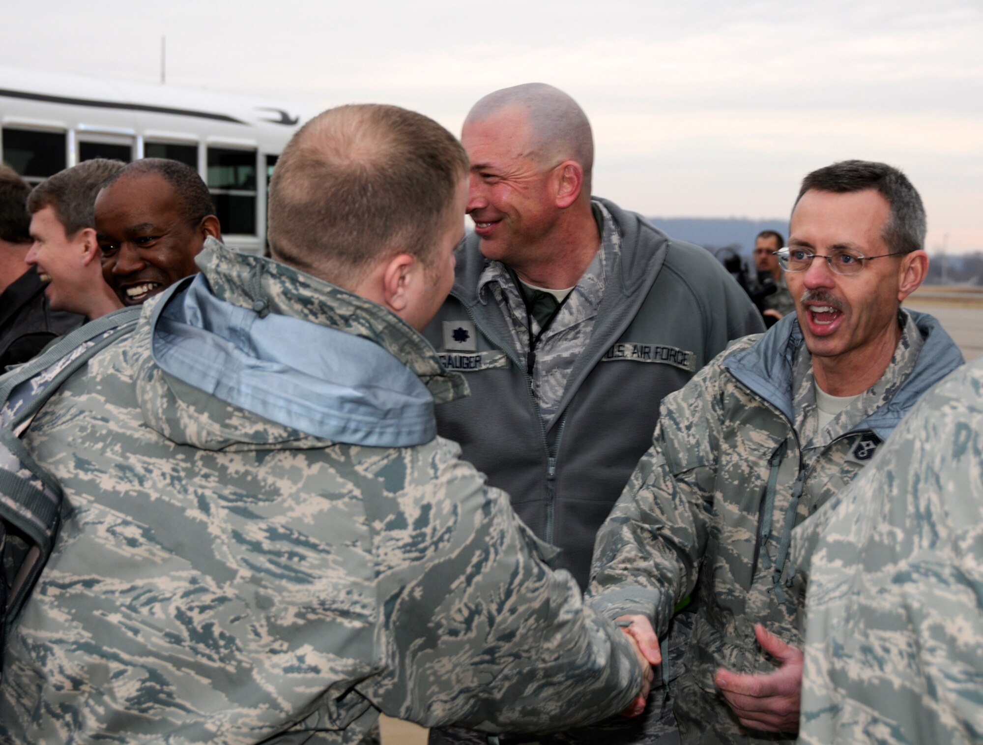 Chief Master Sgt. Steve Arnold, Command Chief Master Sgt. for the Arkansas Air National Guard, shakes hands with members of the 188th Fighter Wing March 8, 2010, at Fort Smith, Ark., as the Airmen prepare to depart for an Aerospace Expeditionary Forces deployment. The 188th will be deployed to Kandahar, Afghanistan, for more than two months. The 188th will be attached to the 451st Expeditionary Wing while at Kandahar Airfield. This marks the 188th's first combat deployment with the A-10 Thunderbolt II "Warthog."  (U.S. Air Force photo by Technical Sgt. Stephen M. Hornsey/188th Fighter Wing Public Affairs)