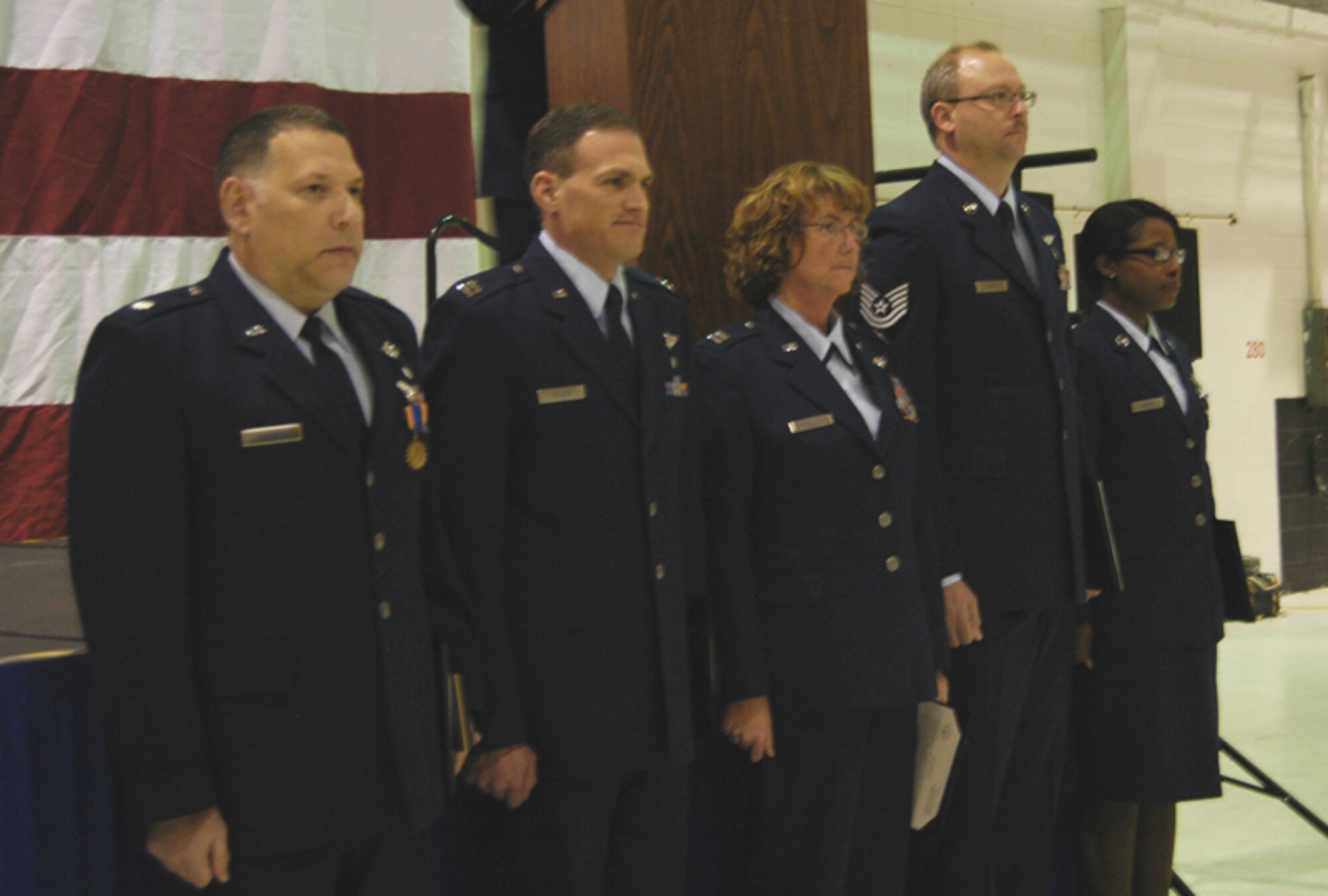 94th Aeromedical Evacuation Squadron members, Lt. Col David E. Rodberg, Capt. Jeff M. Wilson and , Capt. Karen L. Knoblock, aeromedical evacuation flight nurses, and Tech. Sgt. Michael S. Beck, Aeromedical Evacuation Technician receive the Air Medal for meritorious achievement Jan. thru May 2009 at the 332d Expeditionary Wing, Joint Base Balad, Iraq at the wing commander’s call March 6. (U.S. Air Force photo/Airman 1st Class Jennifer K. Meeks)
