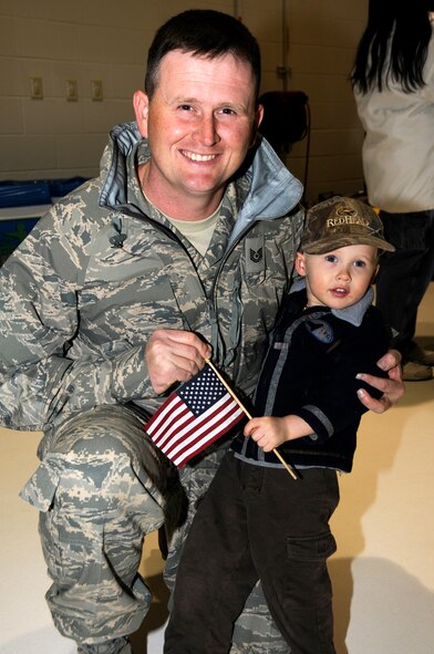 Tech Sgt. Josh Jones and son, Eli, spend time together before Jones' departure for an Aerospace Expeditionary Forces deployment March 8, 2010, at Fort Smith, Ark. More than 200 Airmen from the 188th Fighter Wing departed the Air National Guard unit for Kandahar, Afghanistan, for a deployment slated for more than two months. The 188th will be attached to the 451st Expeditionary Wing while at Kandahar Airfield. This marks the 188th's first combat deployment with the A-10 Thunderbolt II "Warthog."  (U.S. Air Force photo by Tech Sgt. Stephen M. Hornsey/188th Fighter Wing Public Affairs)

